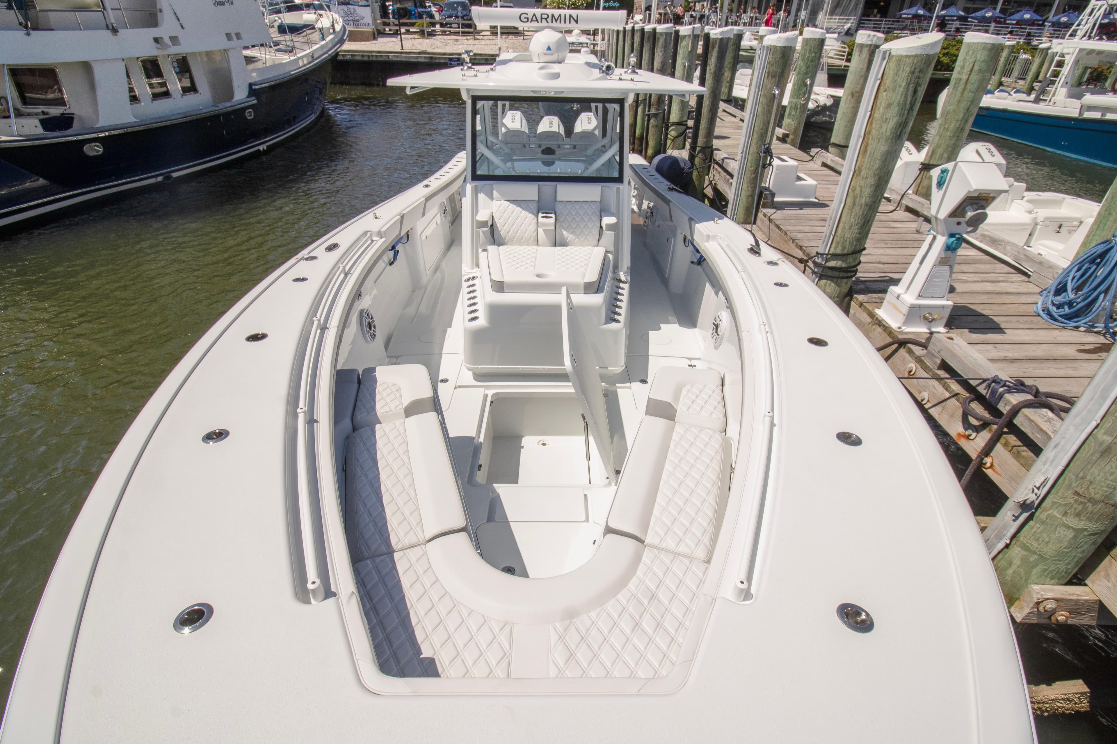 2026 Yellowfin 42 Offshore boat docked, featuring spacious seating and modern design.