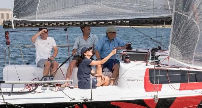 People sailing on a 2026 Beneteau First 24 yacht.