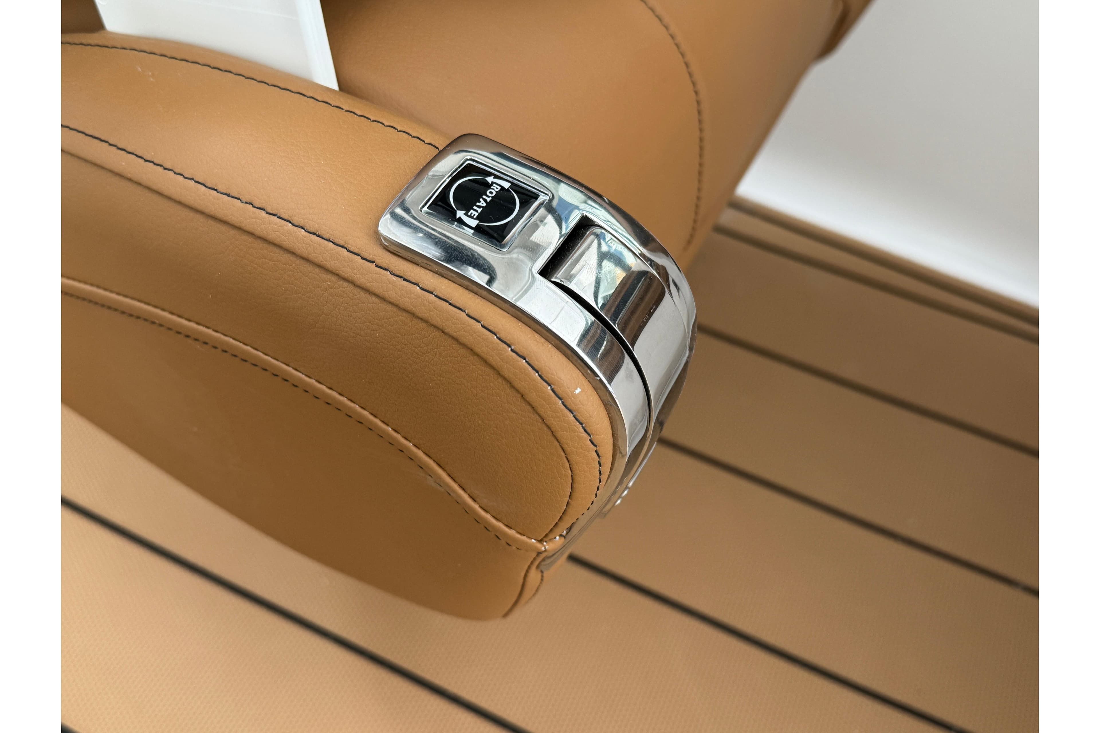 2026 Chaparral 250 OSX boat throttle control on tan leather seat.