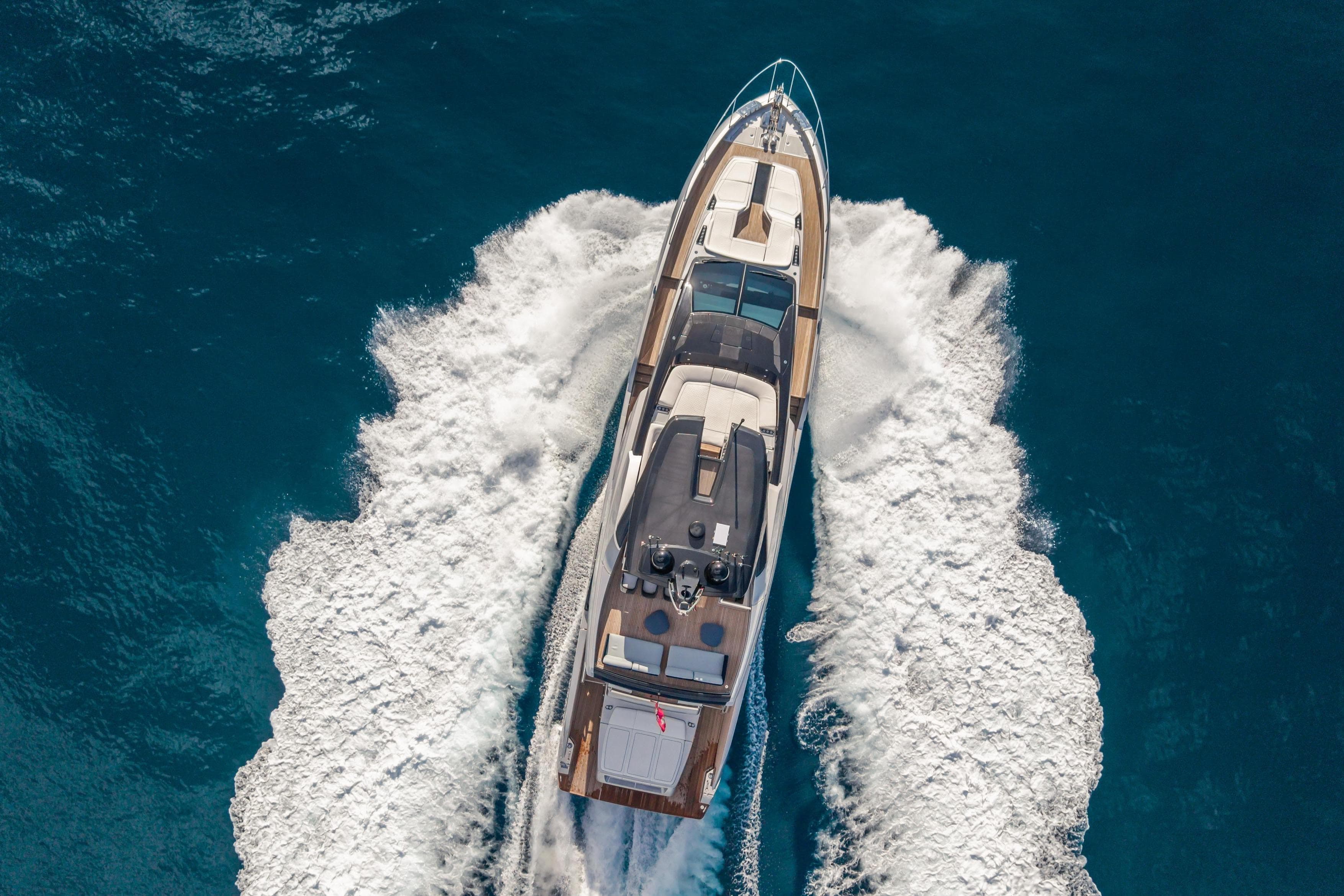 Aerial view of 2026 Riva 82' Diva yacht cruising on open sea.