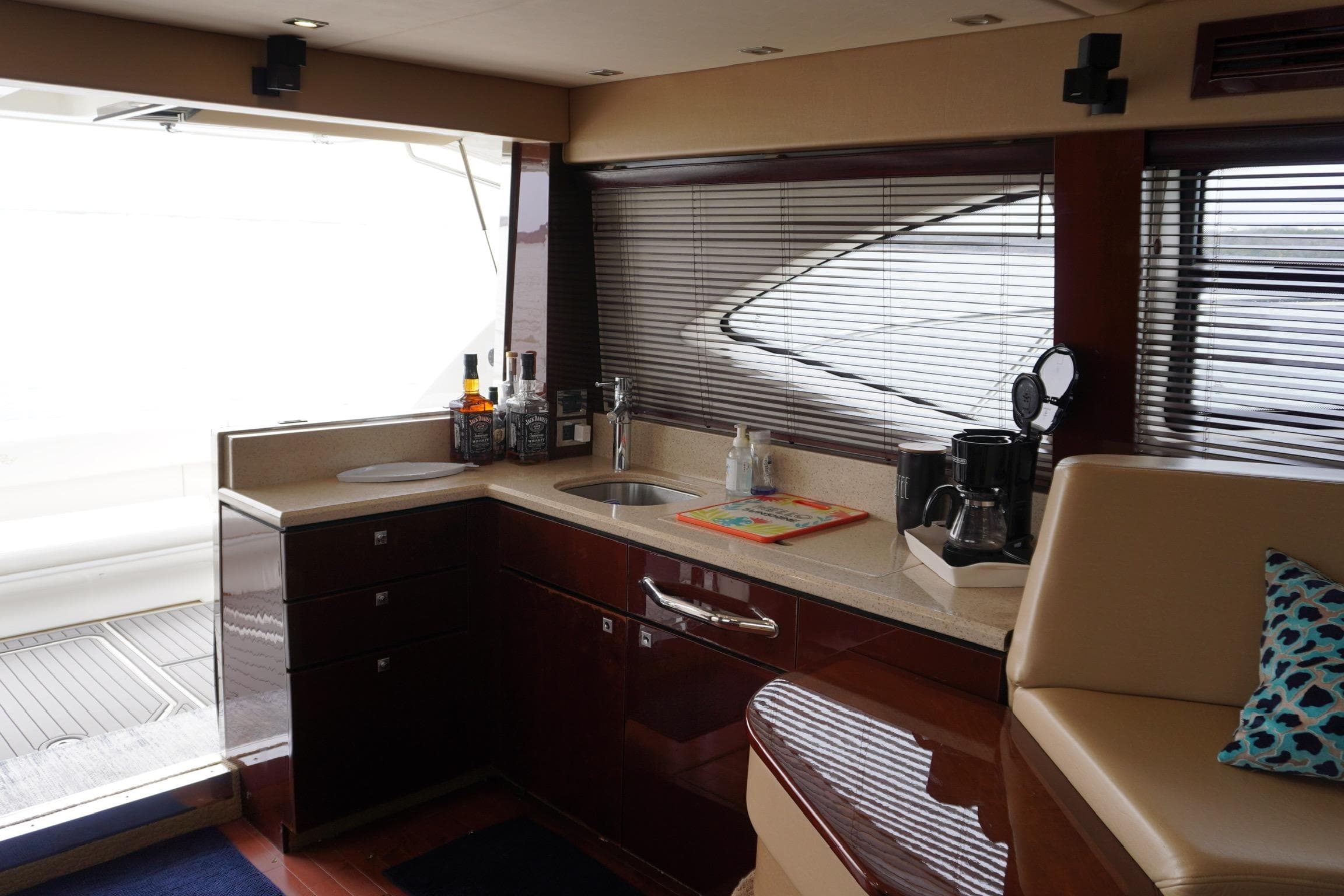 Luxurious interior of 2009 Sea Ray 47 Sedan Bridge yacht with modern kitchen amenities.