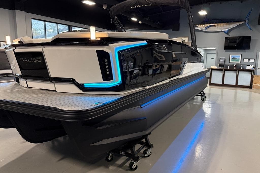 2025 Balise Horizon 24 boat with sleek design and blue LED accents in showroom.
