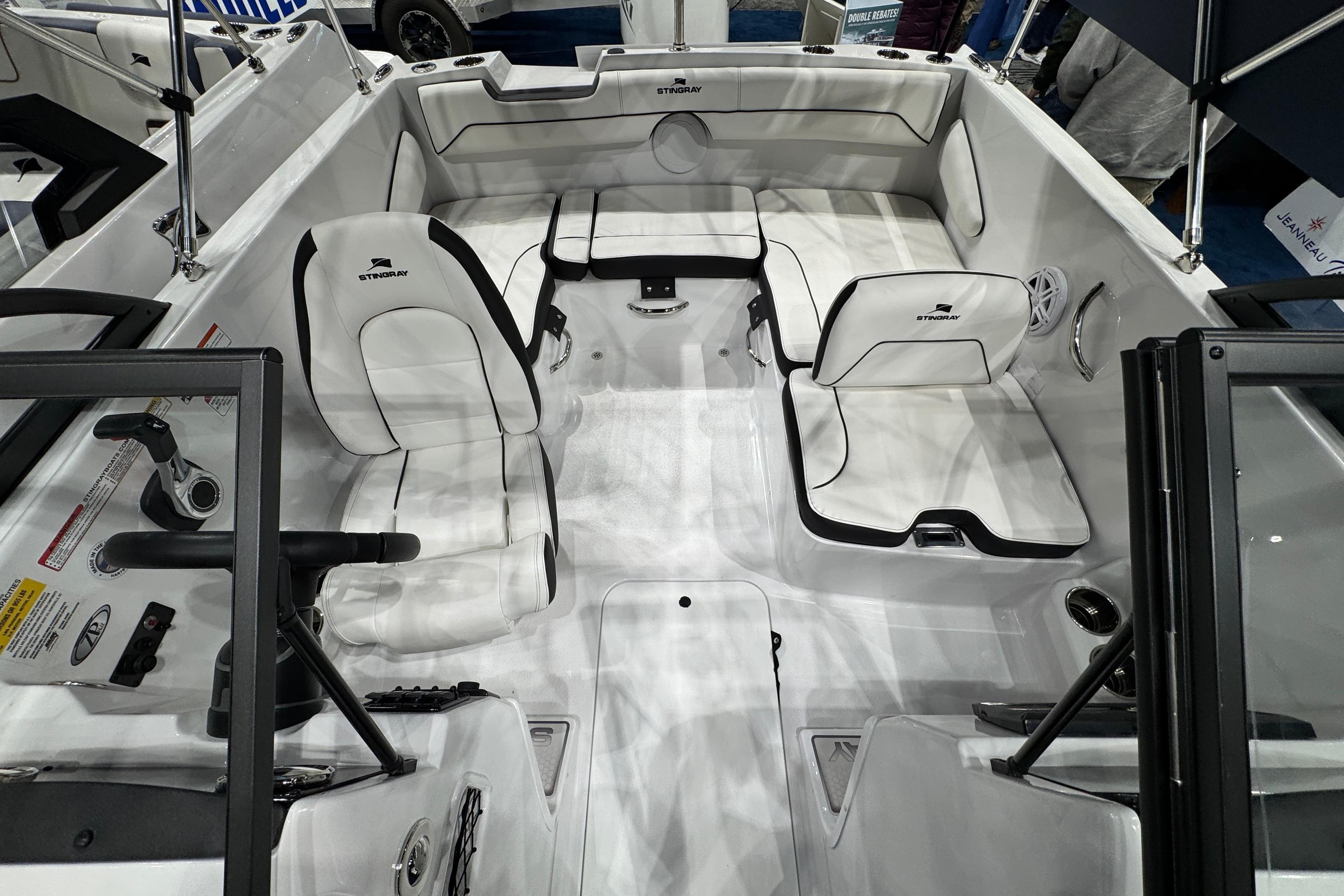 2026 Stingray 172 DC boat interior with white seating and steering console.