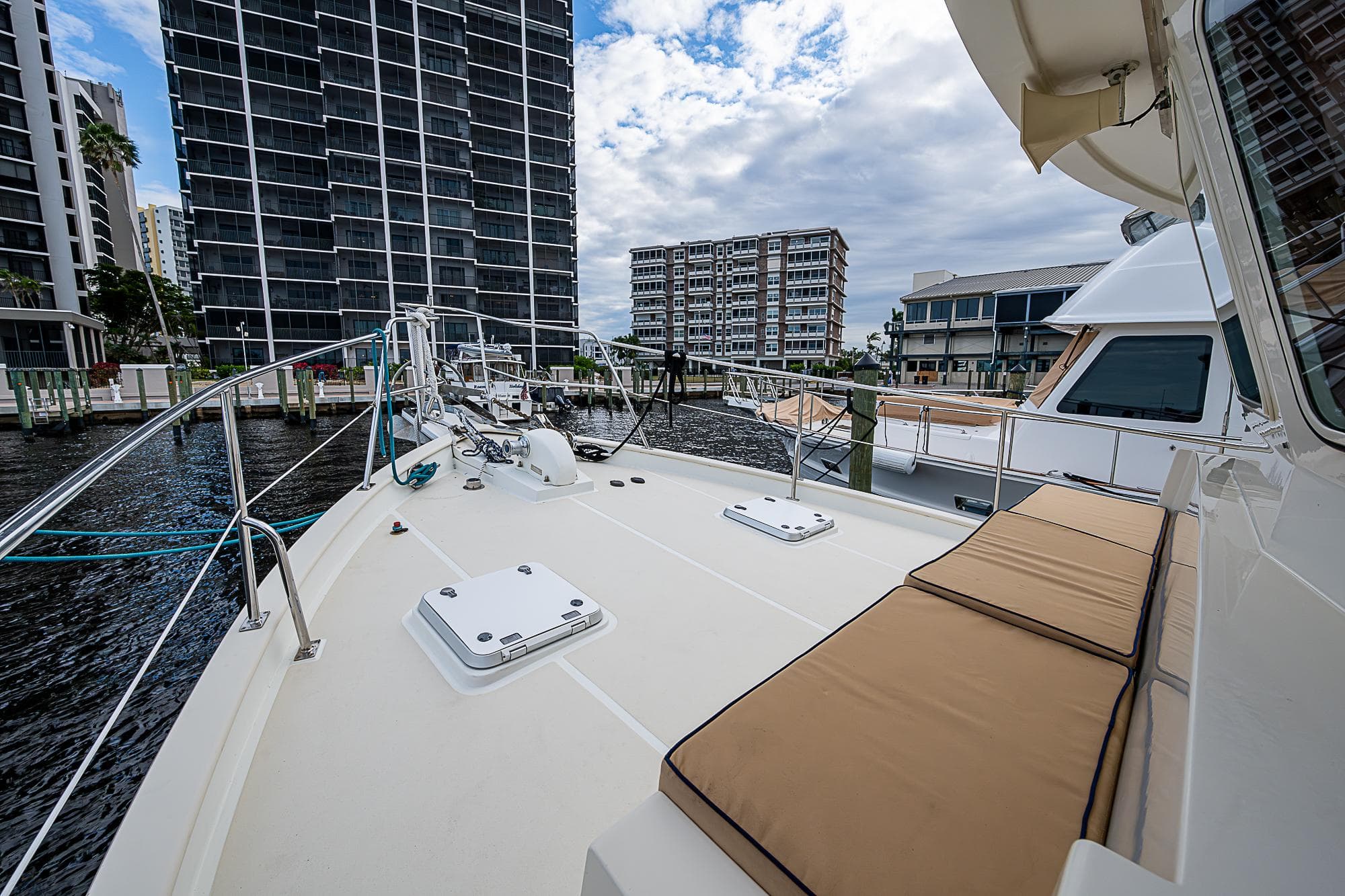 2004 Kadey-Krogen Krogen North Sea yacht deck with urban waterfront view.