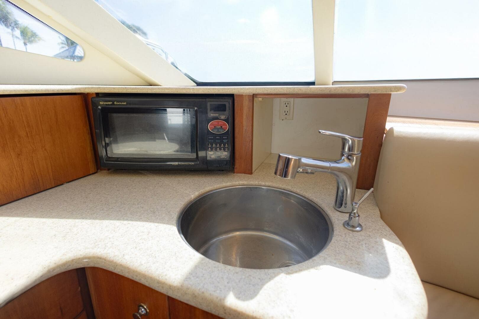 2001 Silverton 410 Sport Bridge kitchen area with microwave and sink.