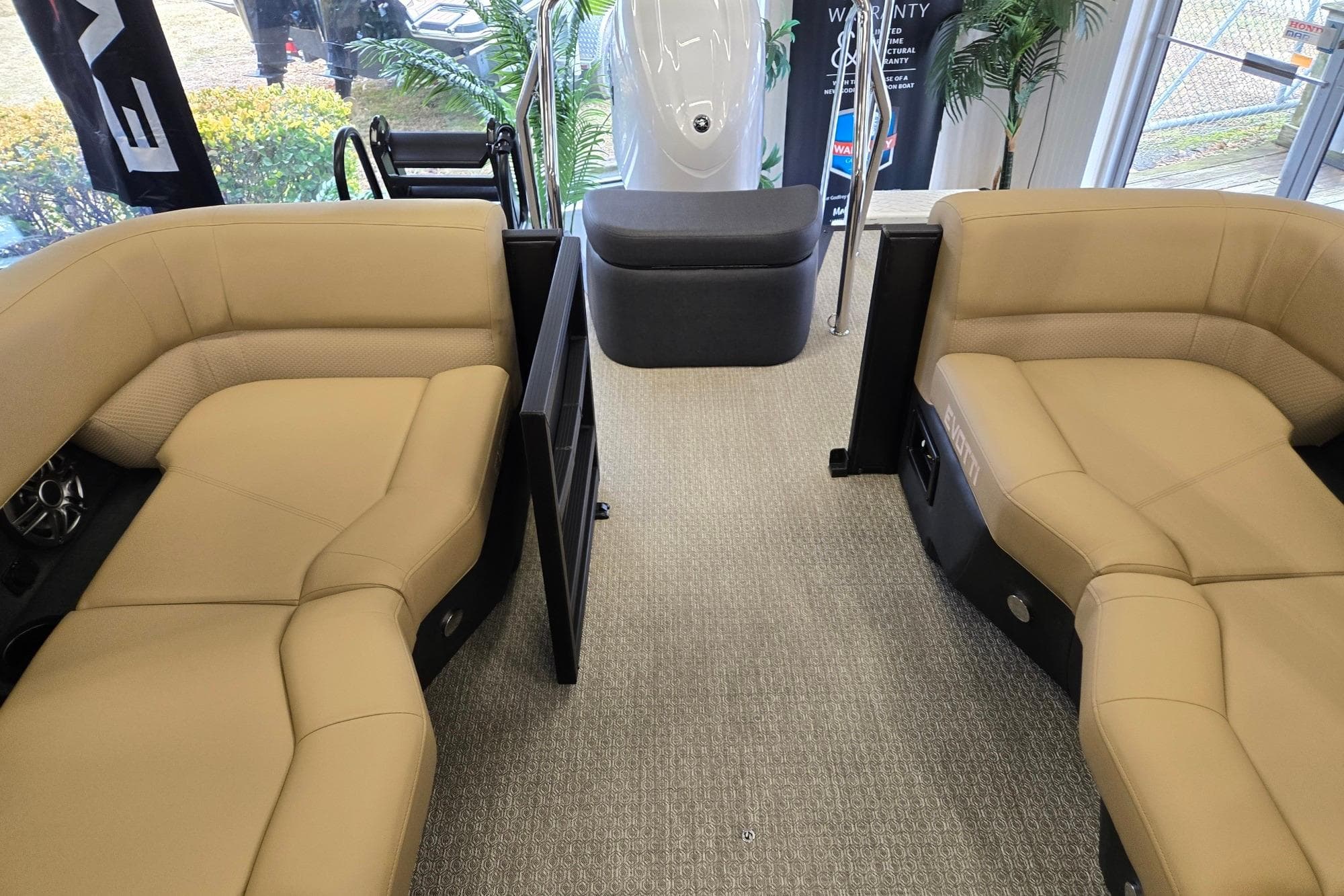 Luxurious interior of 2026 Evotti 521QL boat with beige seating and modern design.
