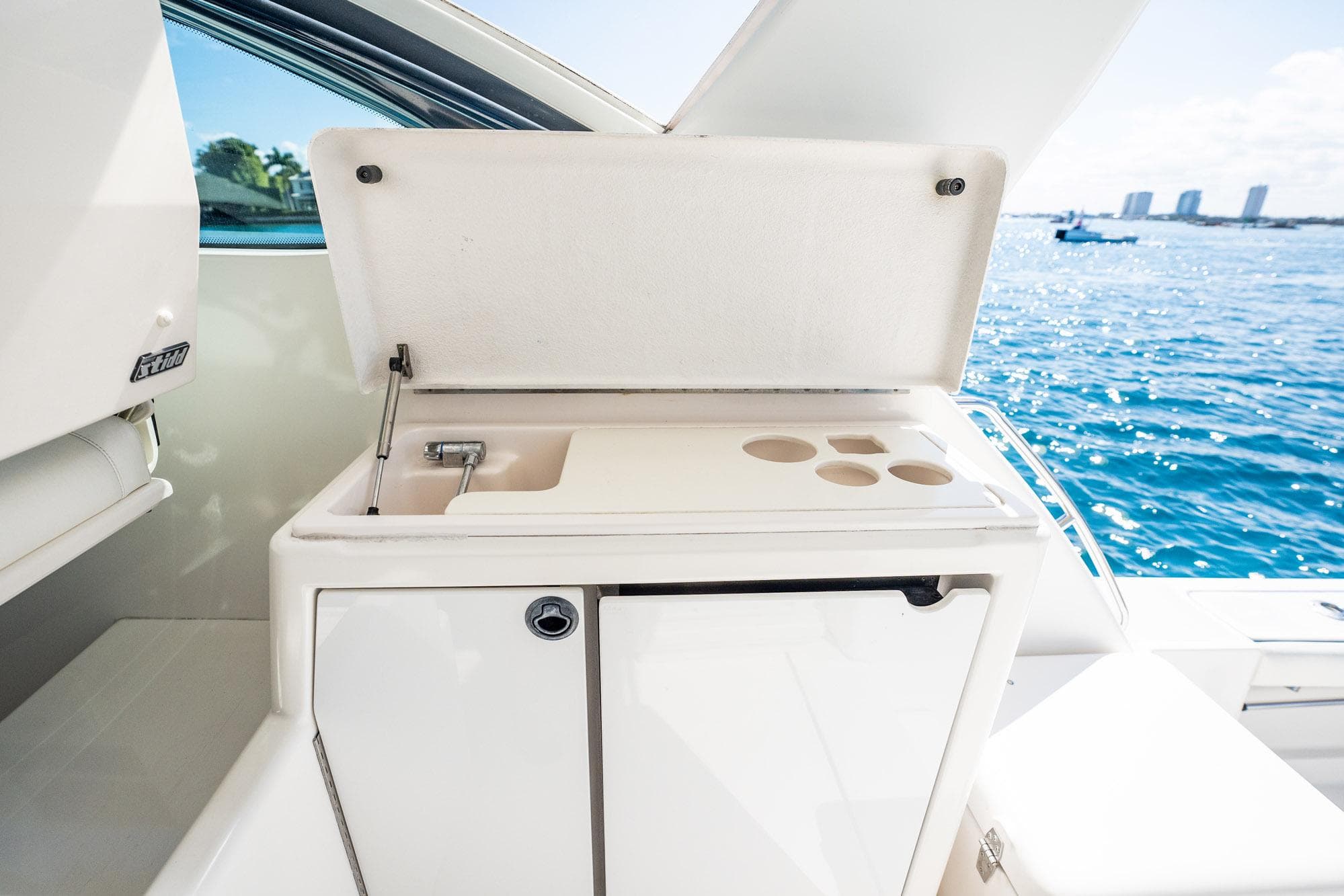 2004 Tiara Yachts 4200 Open yacht sink and storage with ocean view.