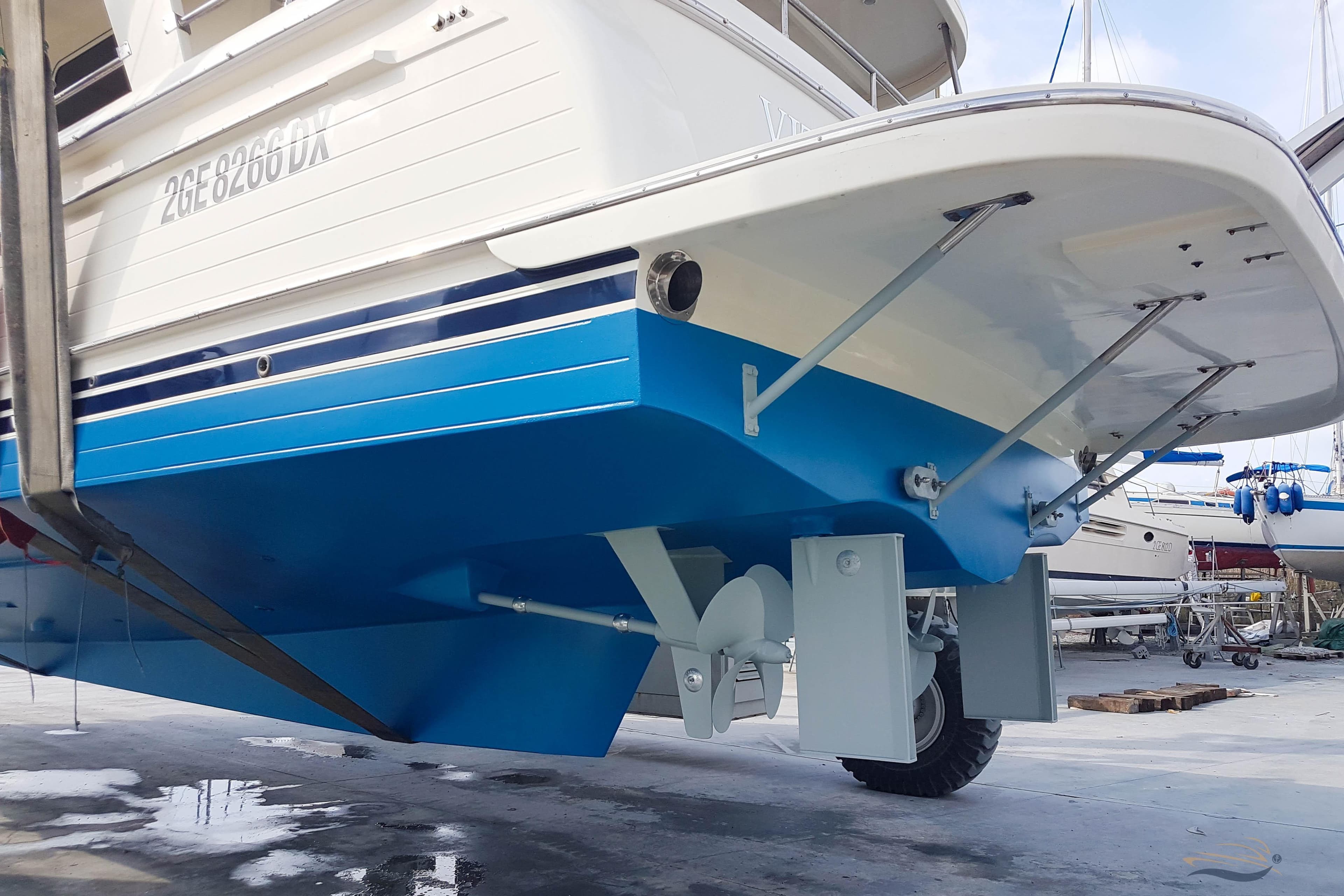 2009 Adagio 51.5 Europa yacht in dry dock, showcasing hull and propeller details.