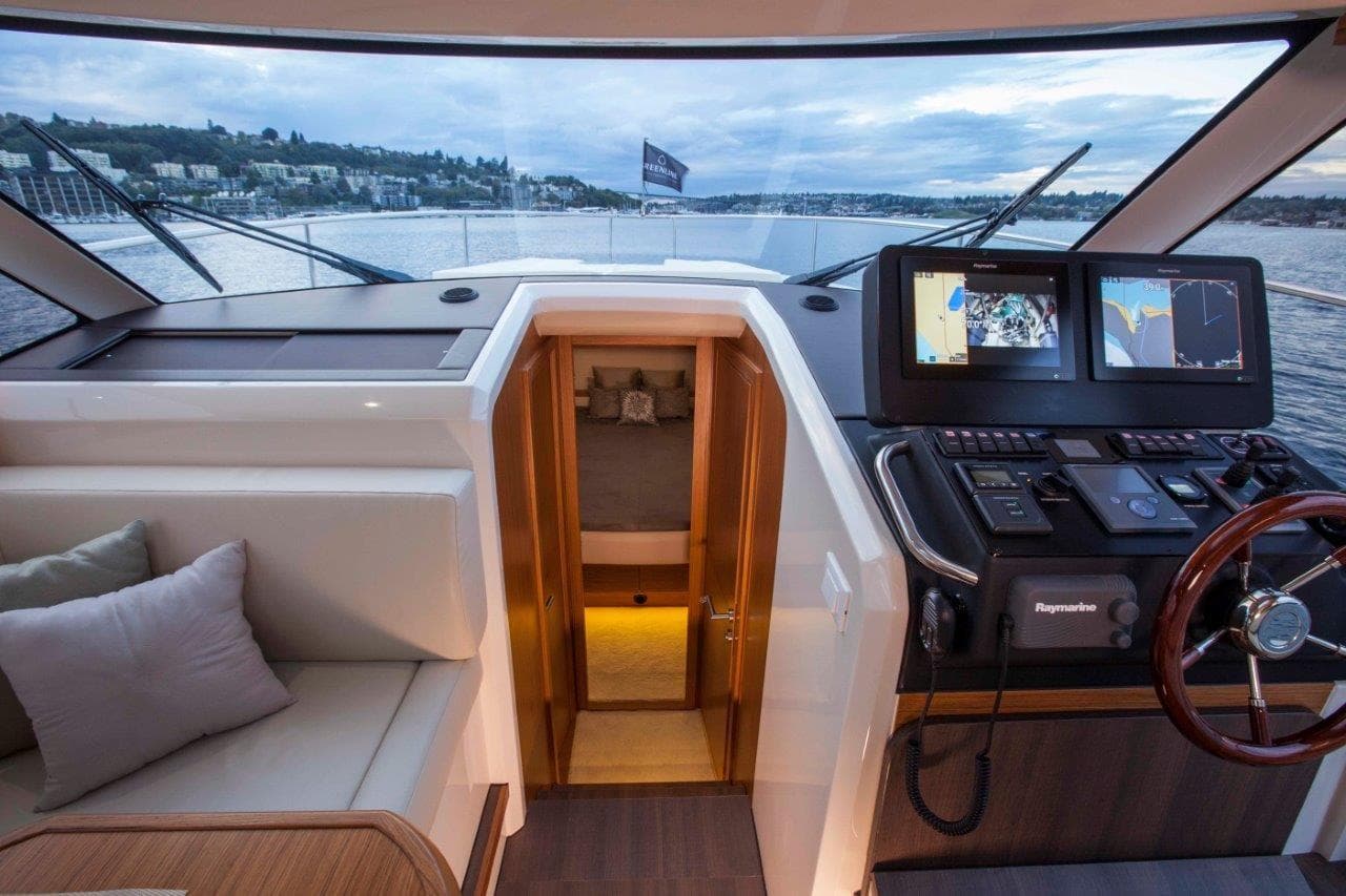 2026 Greenline 39 Hybrid yacht interior with navigation system and seating area.