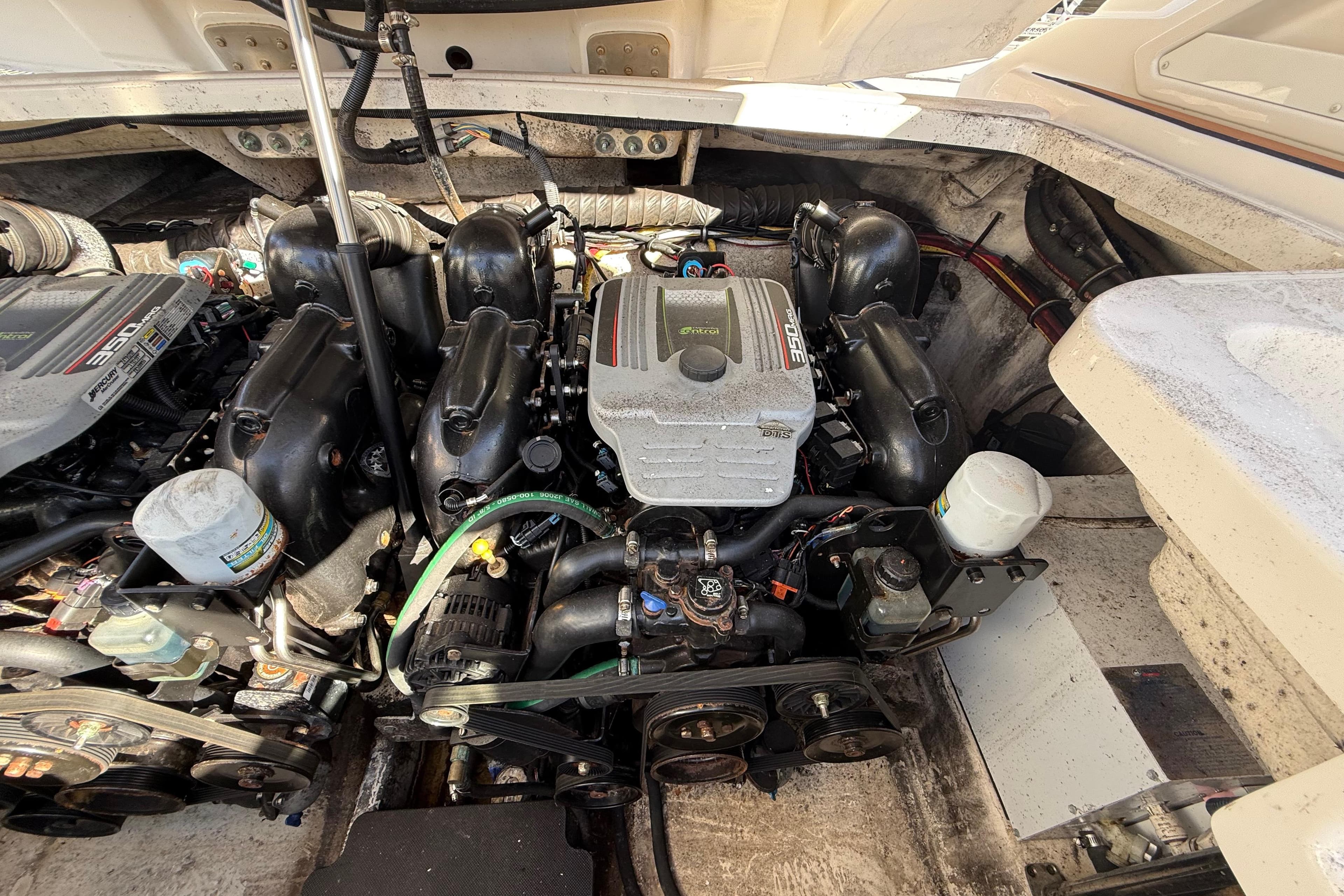Engine compartment of a 2014 Monterey 328SS Super Sport boat, showcasing dual engines.