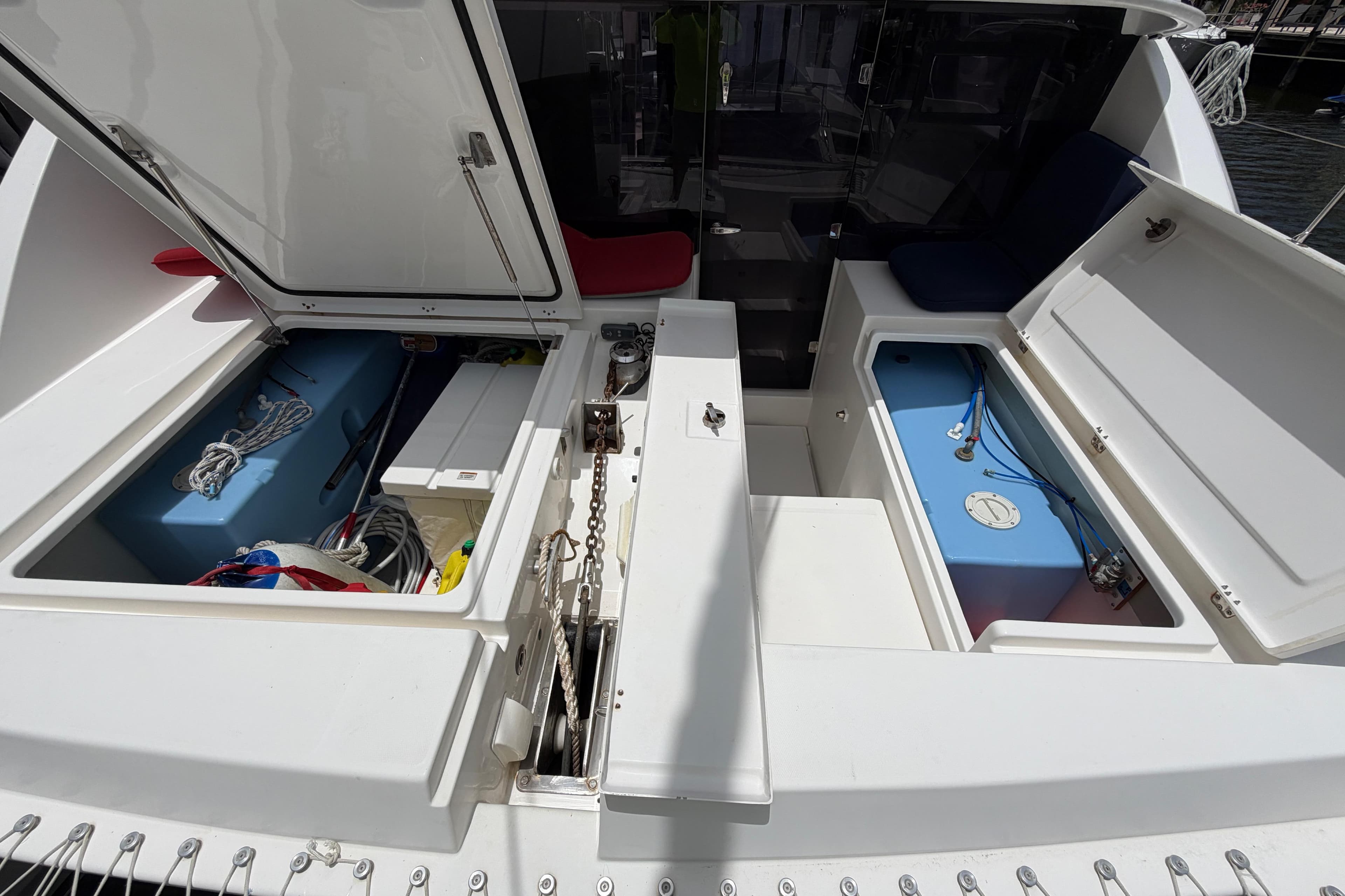 Leopard 40 catamaran storage compartments open, showcasing interior equipment and ropes.
