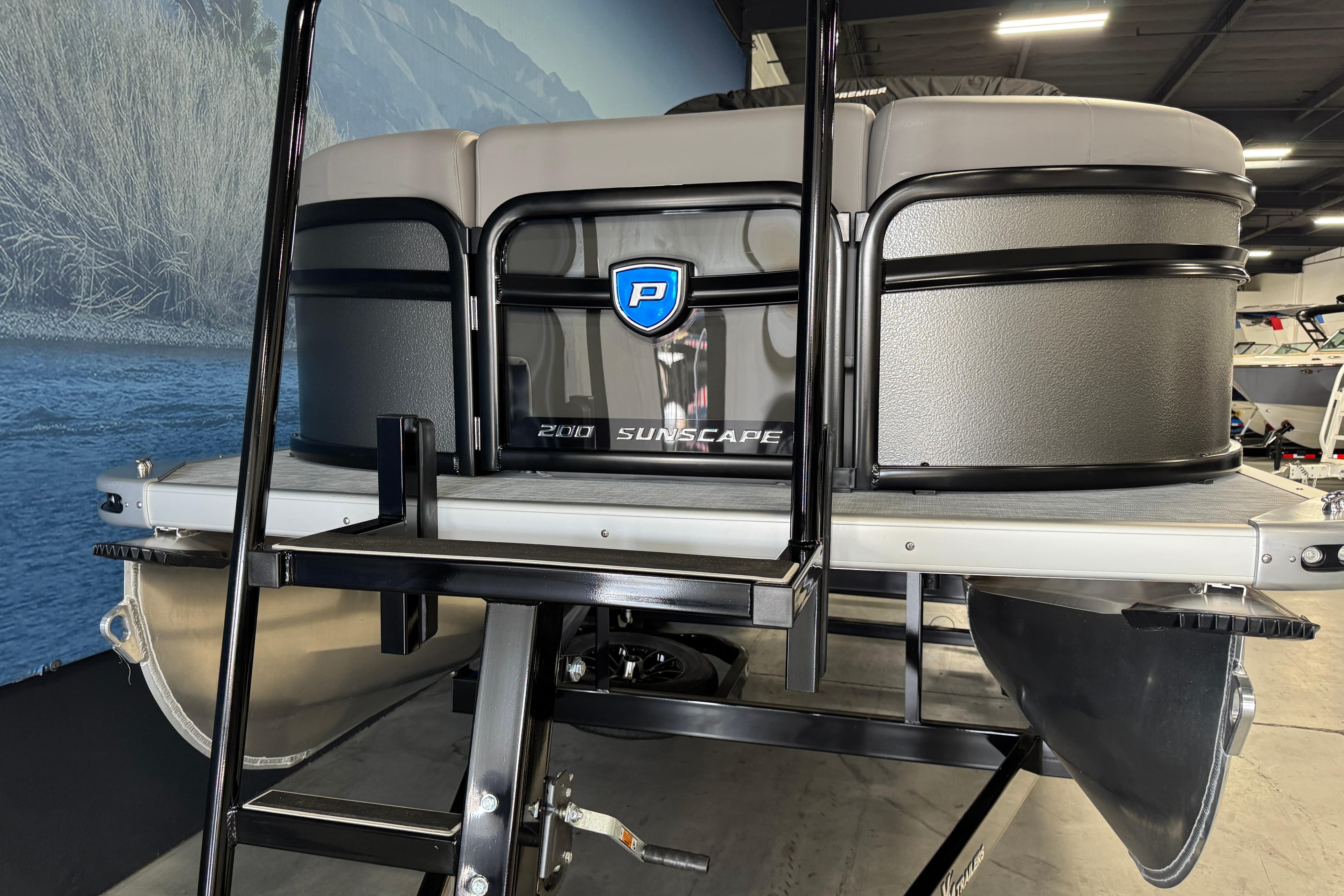 2026 Premier 200 Sunscape RF pontoon boat in showroom, featuring sleek design and modern features.