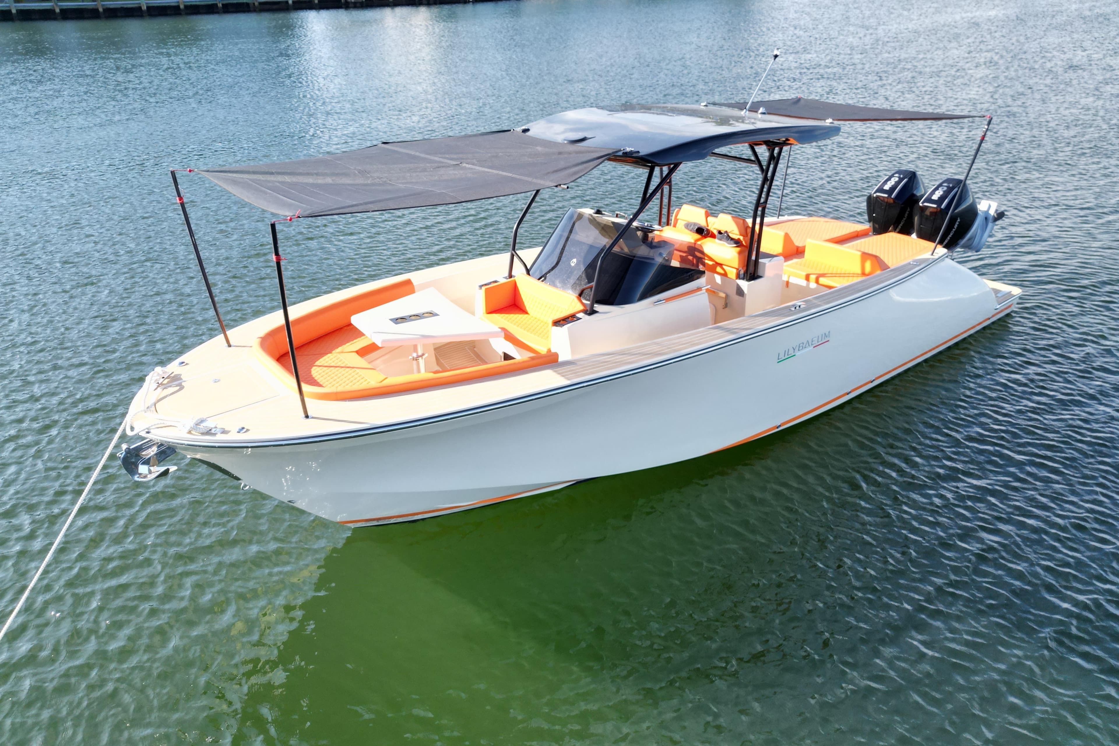 2026 Lilybaeum Lipari 31 boat with orange seating, anchored on calm water.
