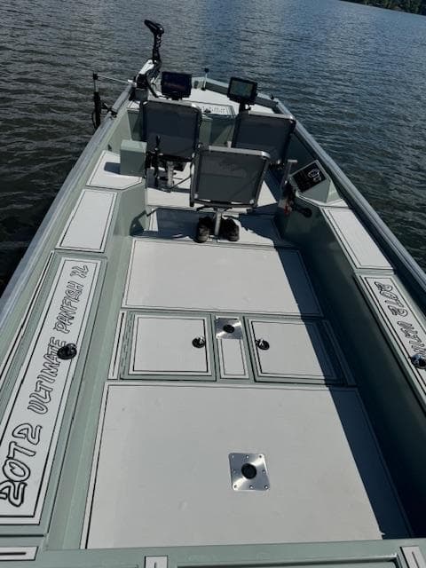Custom Ultimate Panfish XL 2025 fishing boat on calm water.