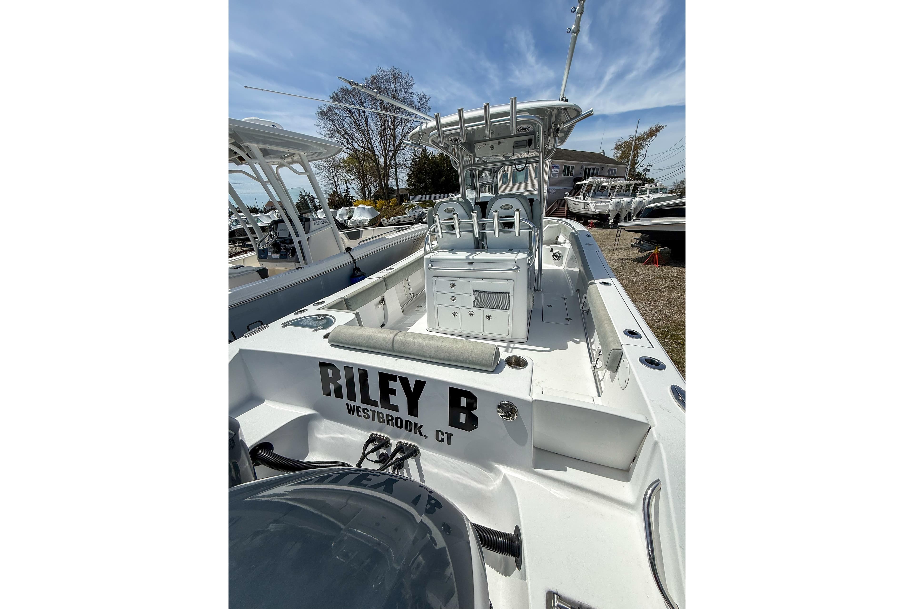 2019 Sportsman Open 282 Center Console boat docked, featuring spacious deck and seating.