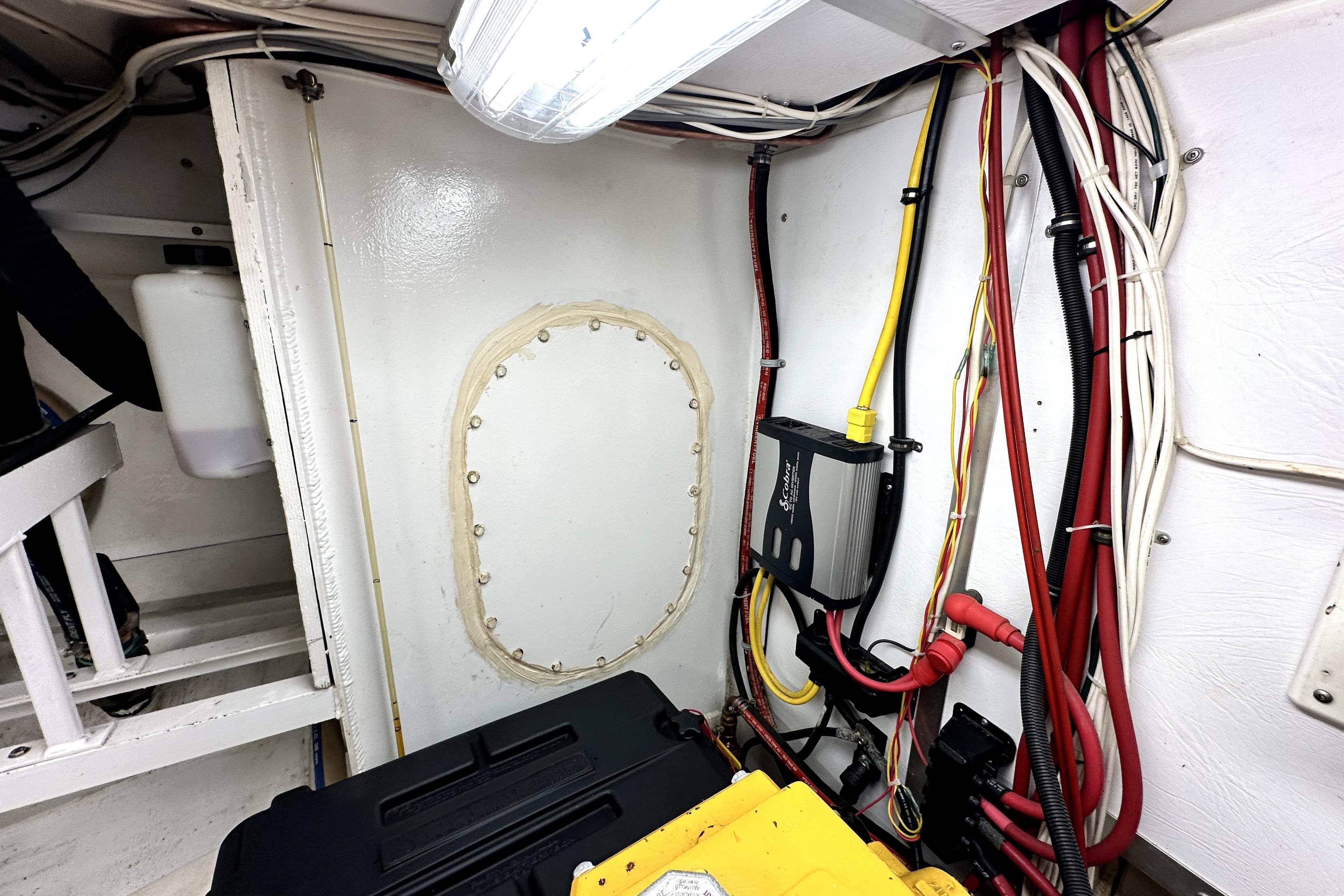Engine room of 2012 Custom Pacific Northwest 43 with wiring and equipment.