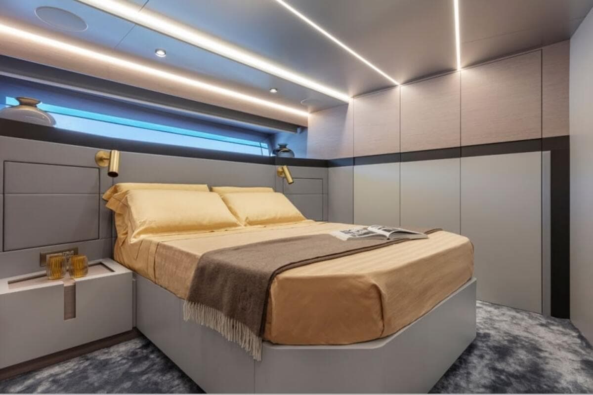 Luxurious bedroom interior on 2021 Palumbo Extra 86 yacht with modern lighting and elegant decor.