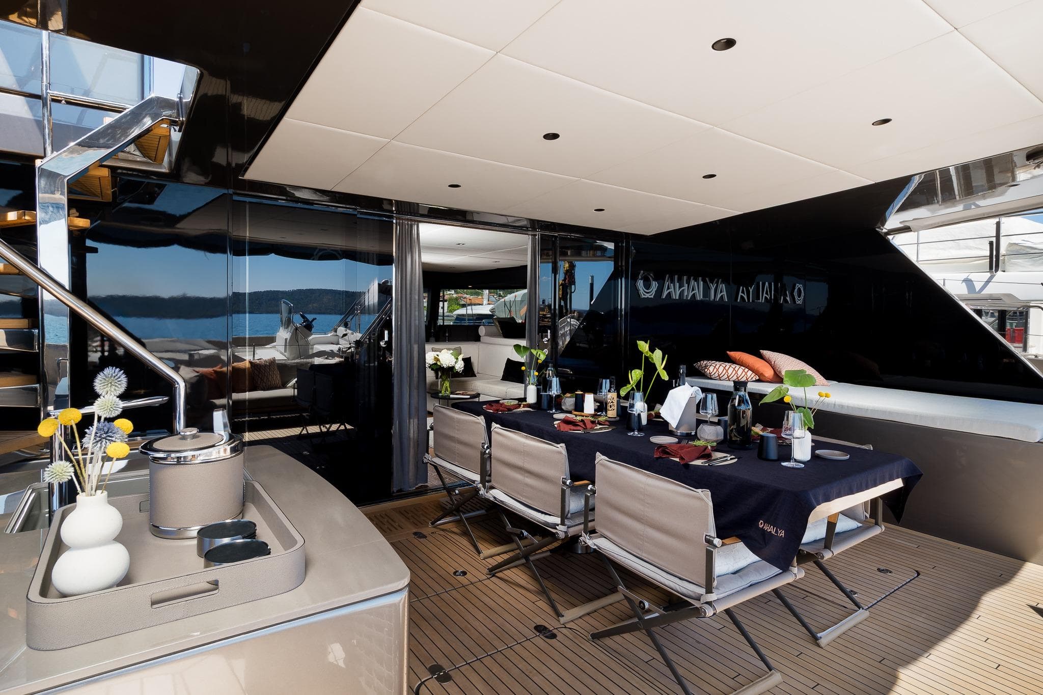 Luxurious dining area on 2025 Sunreef 60 yacht with elegant table setting.