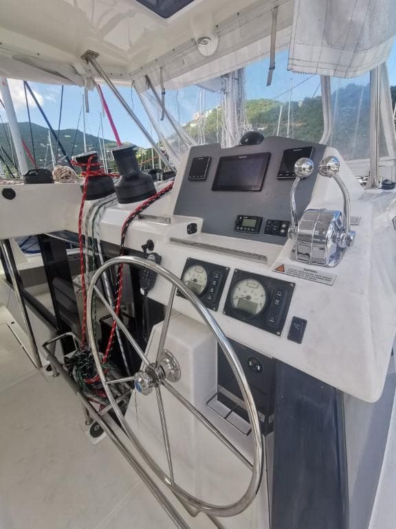 2019 Leopard 50 yacht helm station with navigation instruments and steering wheel.