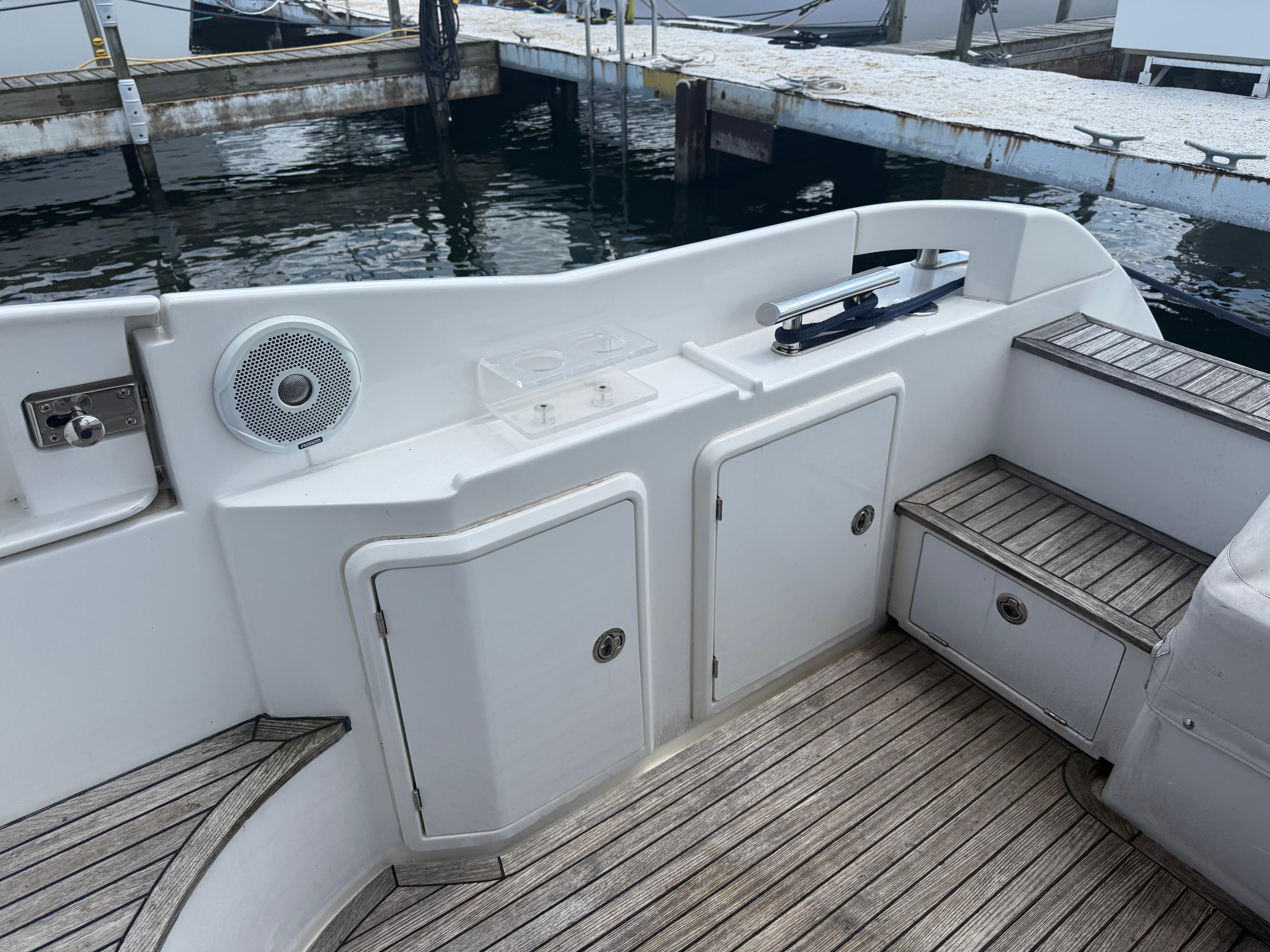 Azimut 42 Fly 2018 yacht deck with storage compartments and speaker.