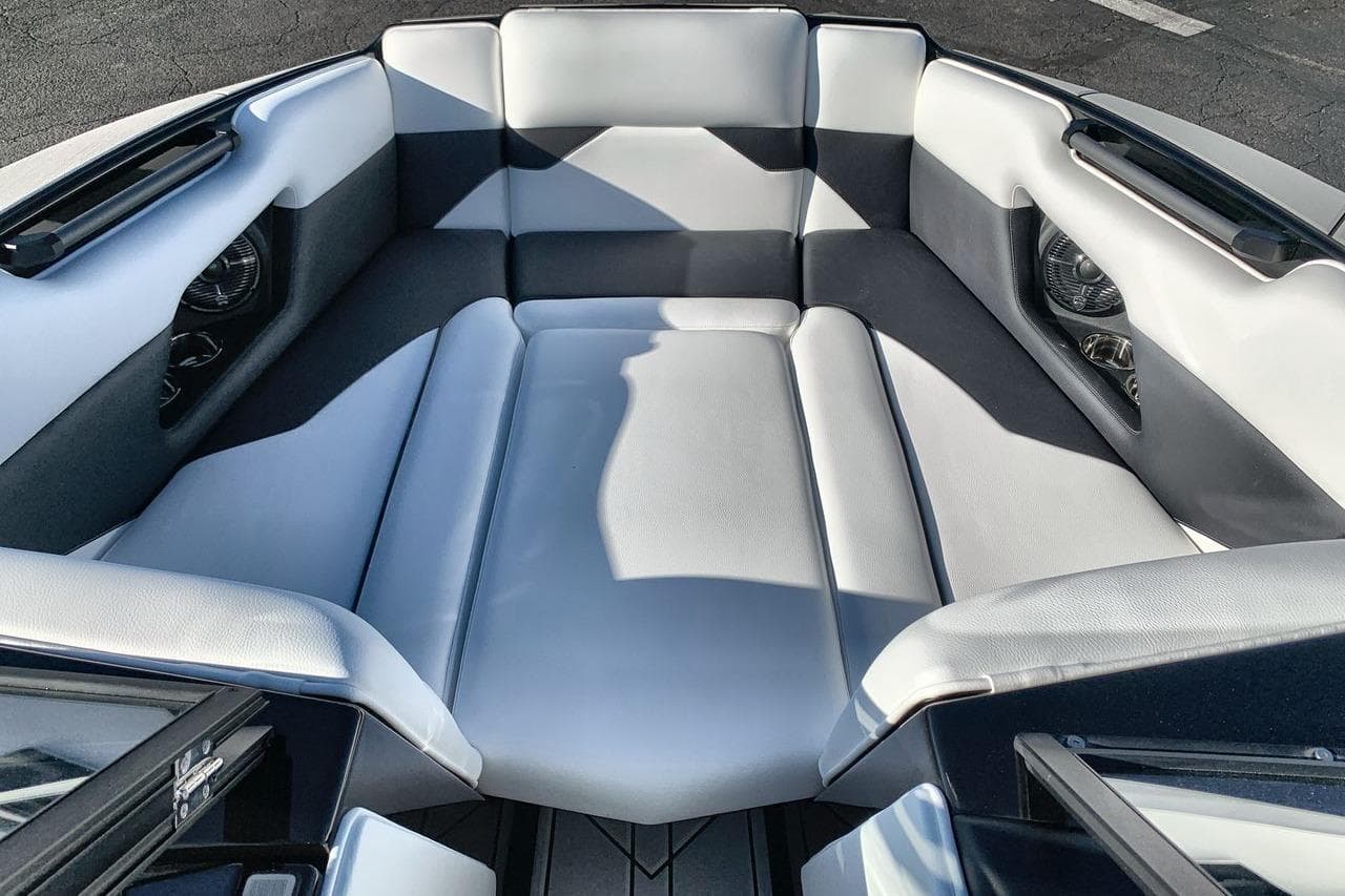 2026 Moomba Mojo boat interior with sleek, modern seating and integrated speakers.