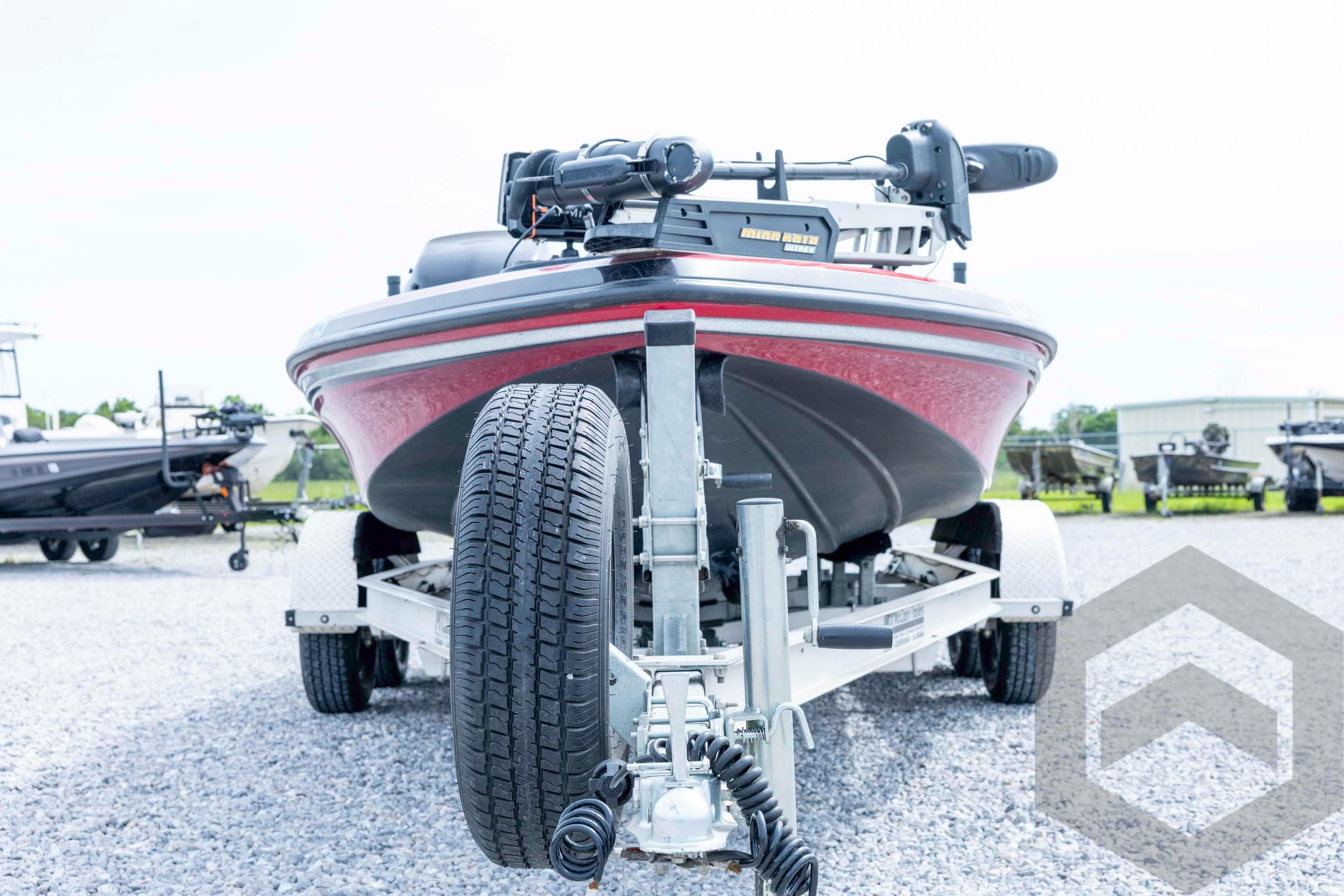 2013 Nitro Z-7 boat on trailer, front view, parked on gravel lot.