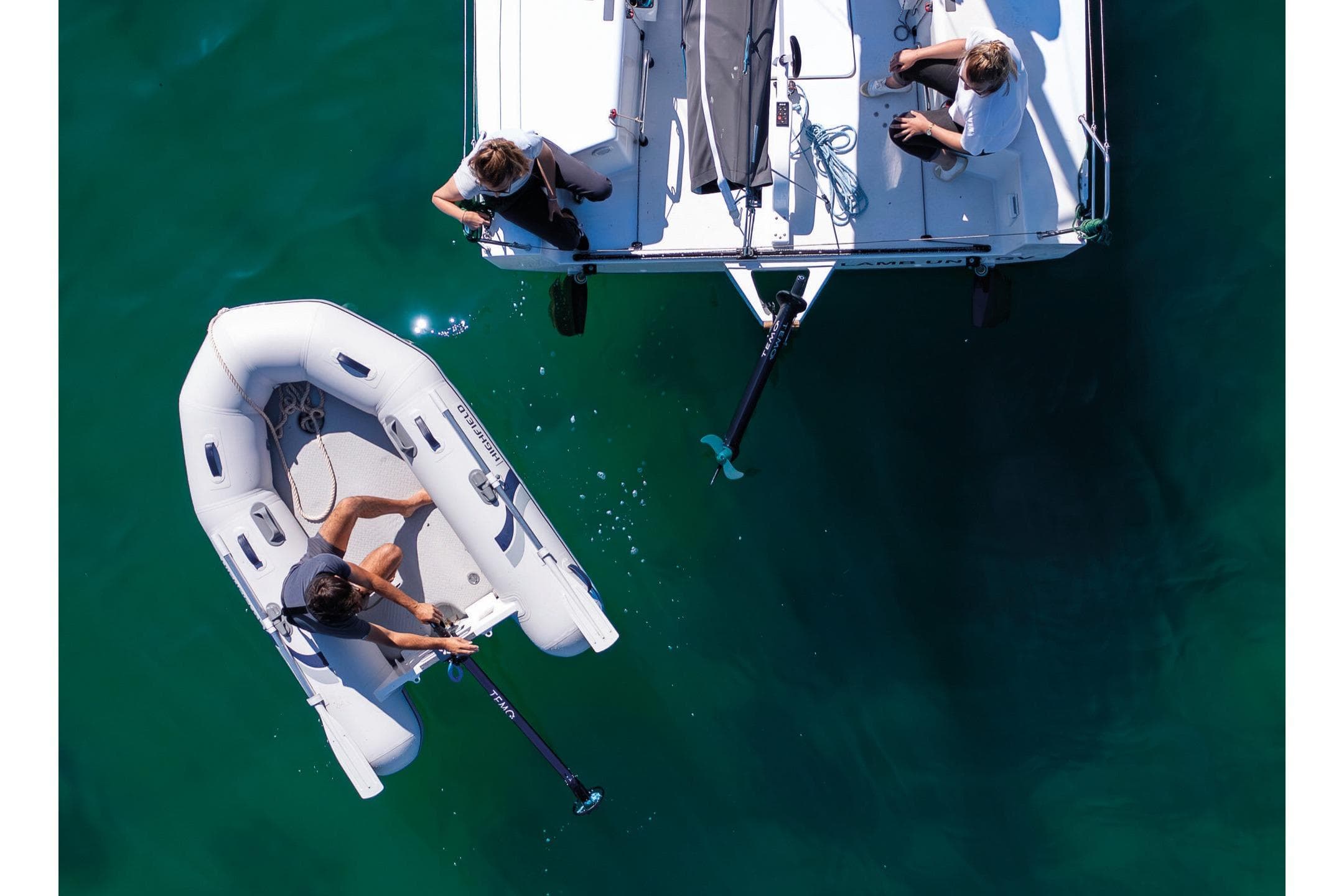 Aerial view of Highfield Roll-Up 250 KAL inflatable boat on water.