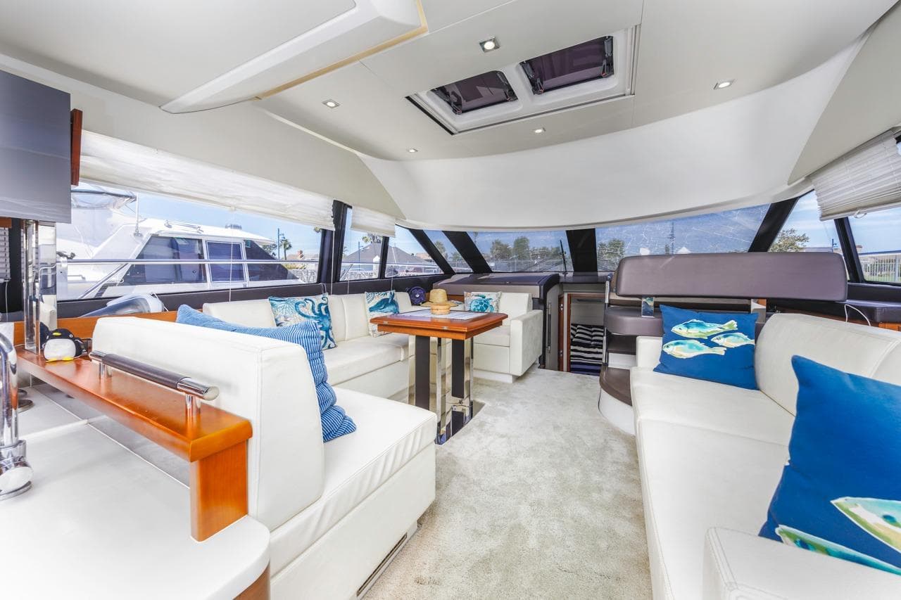 Luxurious interior of 2015 Prestige 500FB yacht with elegant seating and decor.
