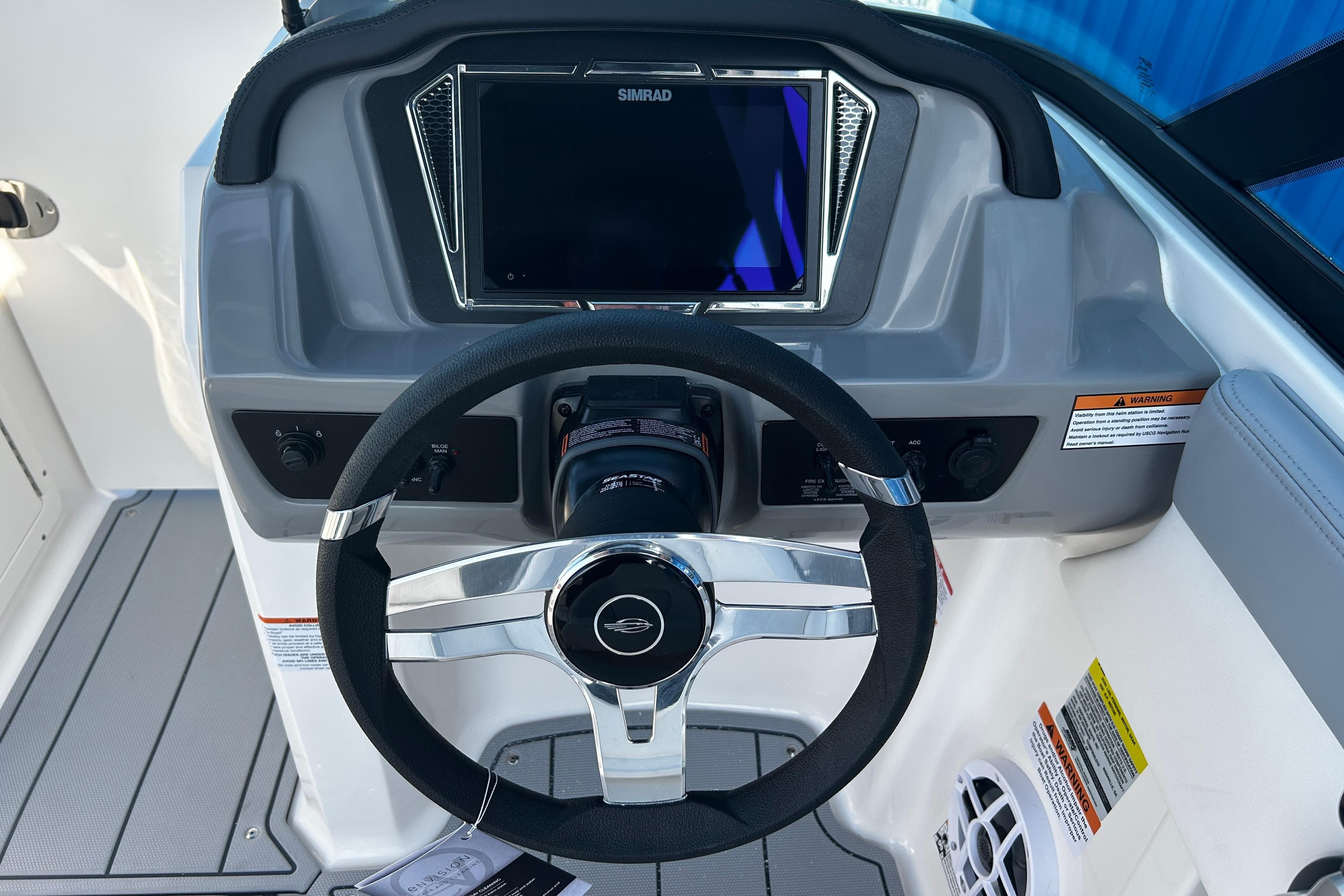 Steering console of 2026 Chaparral 21 SSi OB boat with Simrad display.