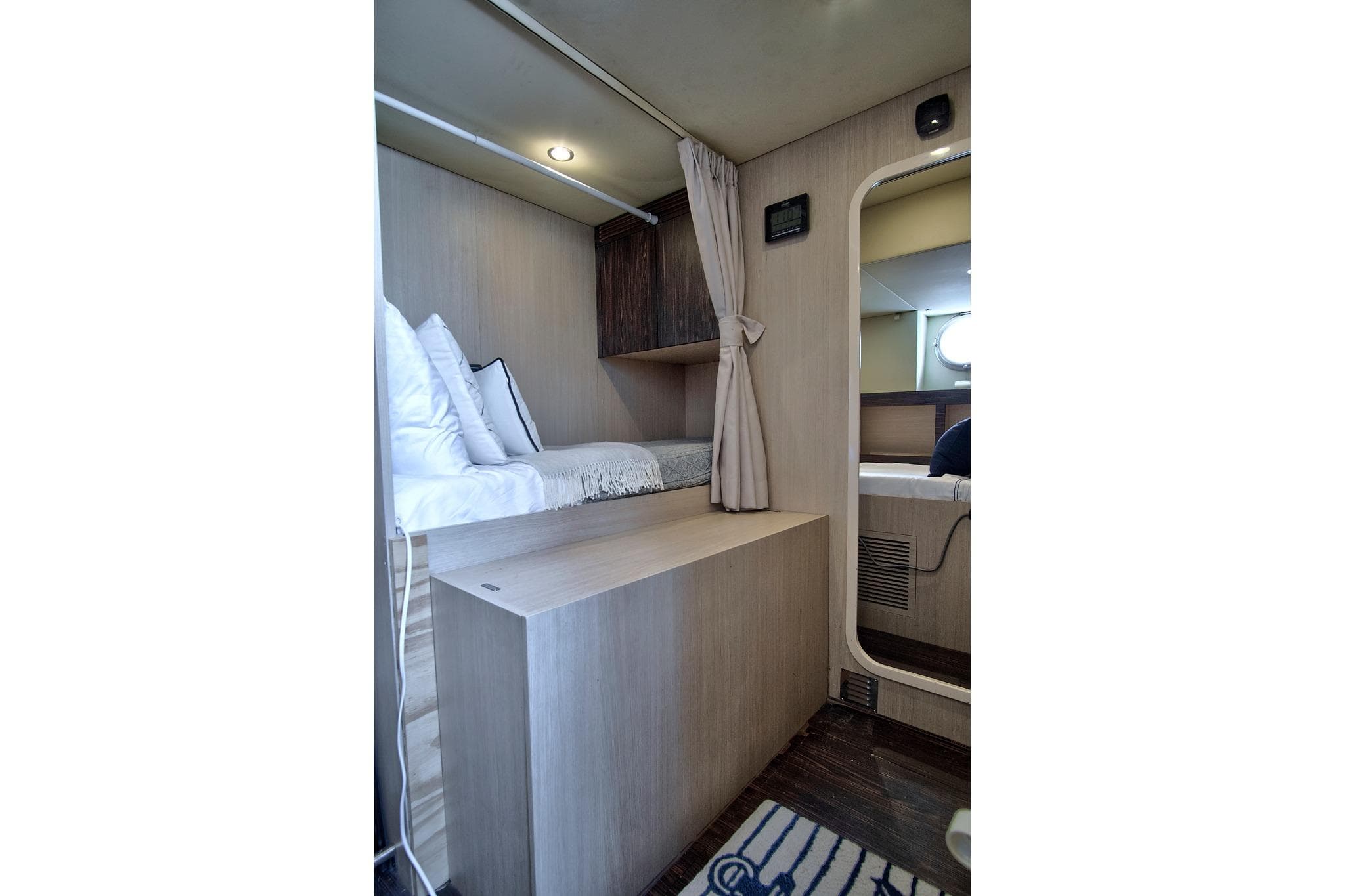 Interior cabin of 2017 Azimut 72 Flybridge yacht, featuring cozy bedding and modern design.