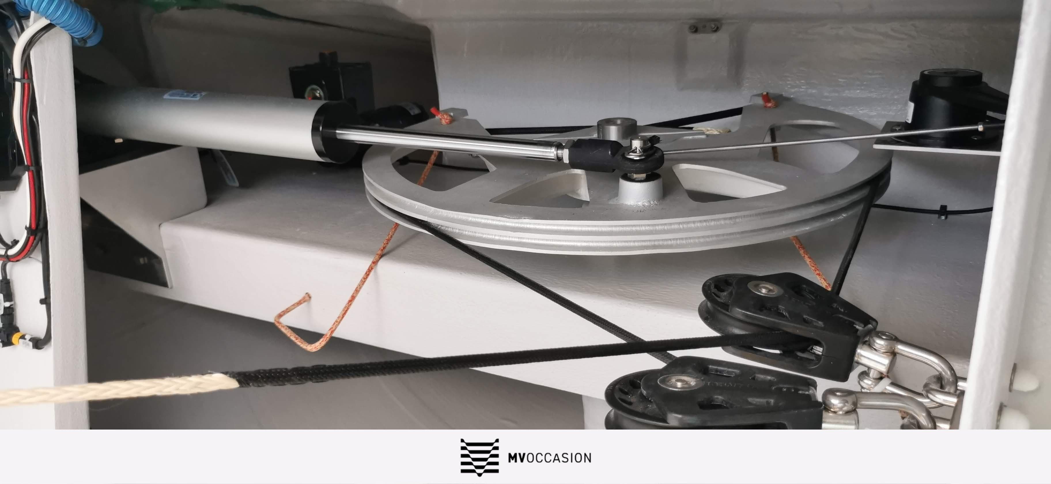 Steering mechanism of a 2021 NEEL 47 trimaran, featuring pulleys and cables.