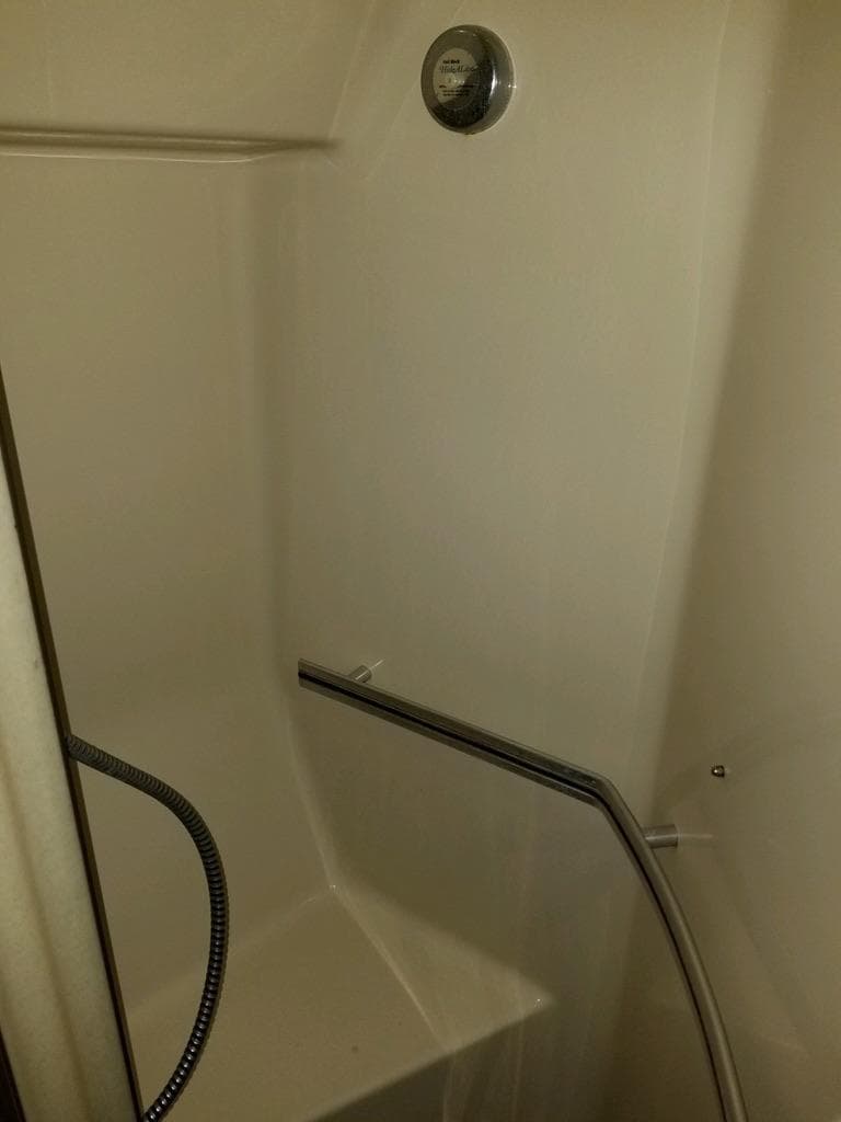 1986 Sea Ray 390 Express shower with handrail and showerhead.