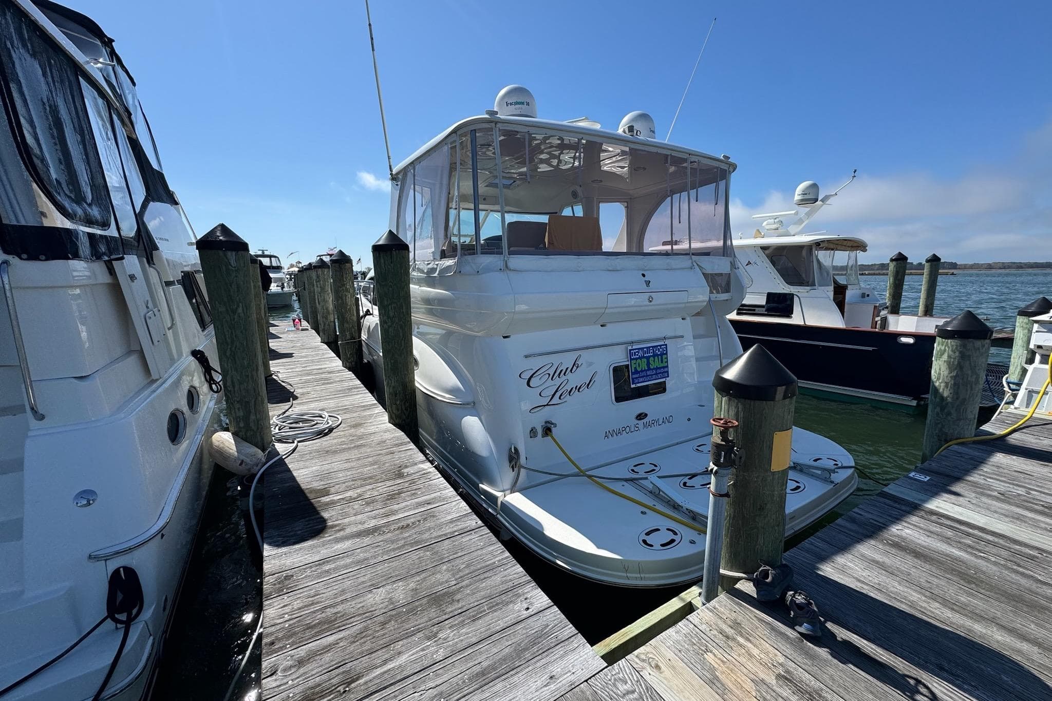 2000 Silverton 392 Motor Yacht docked, rear view, sunny day, for sale sign visible.