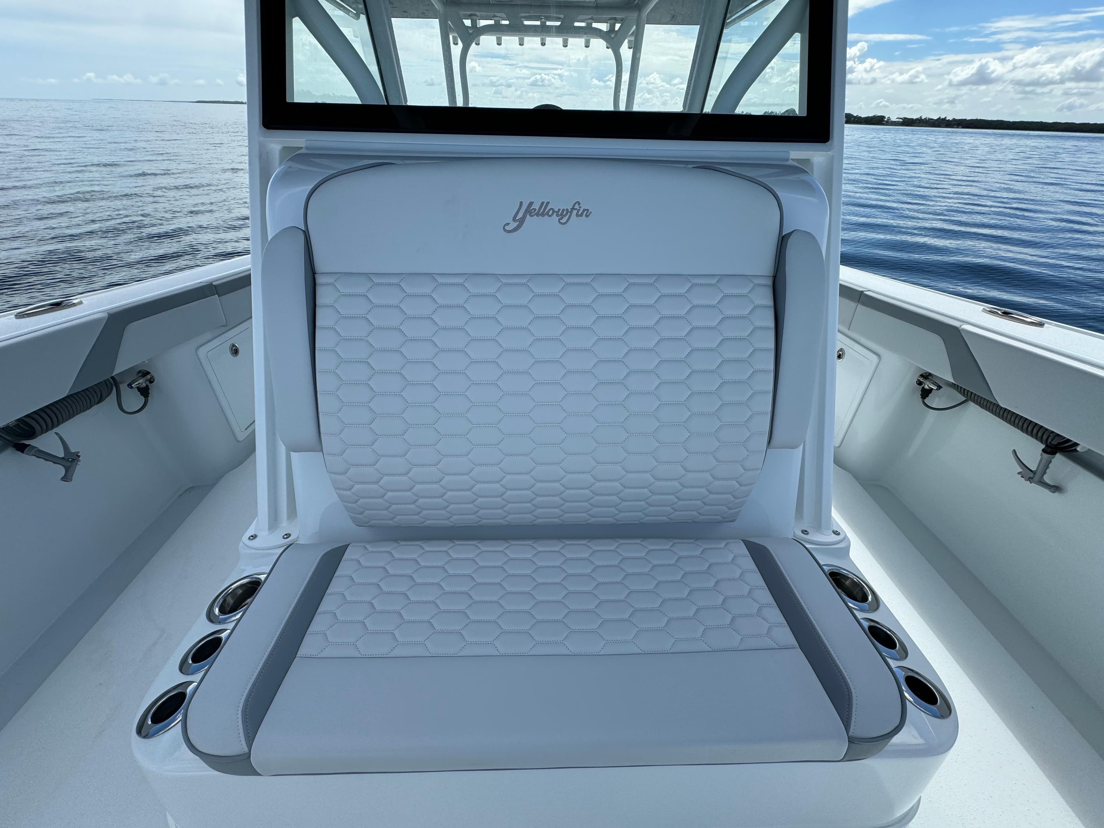2024 Yellowfin 39 boat with cushioned seating and cup holders.