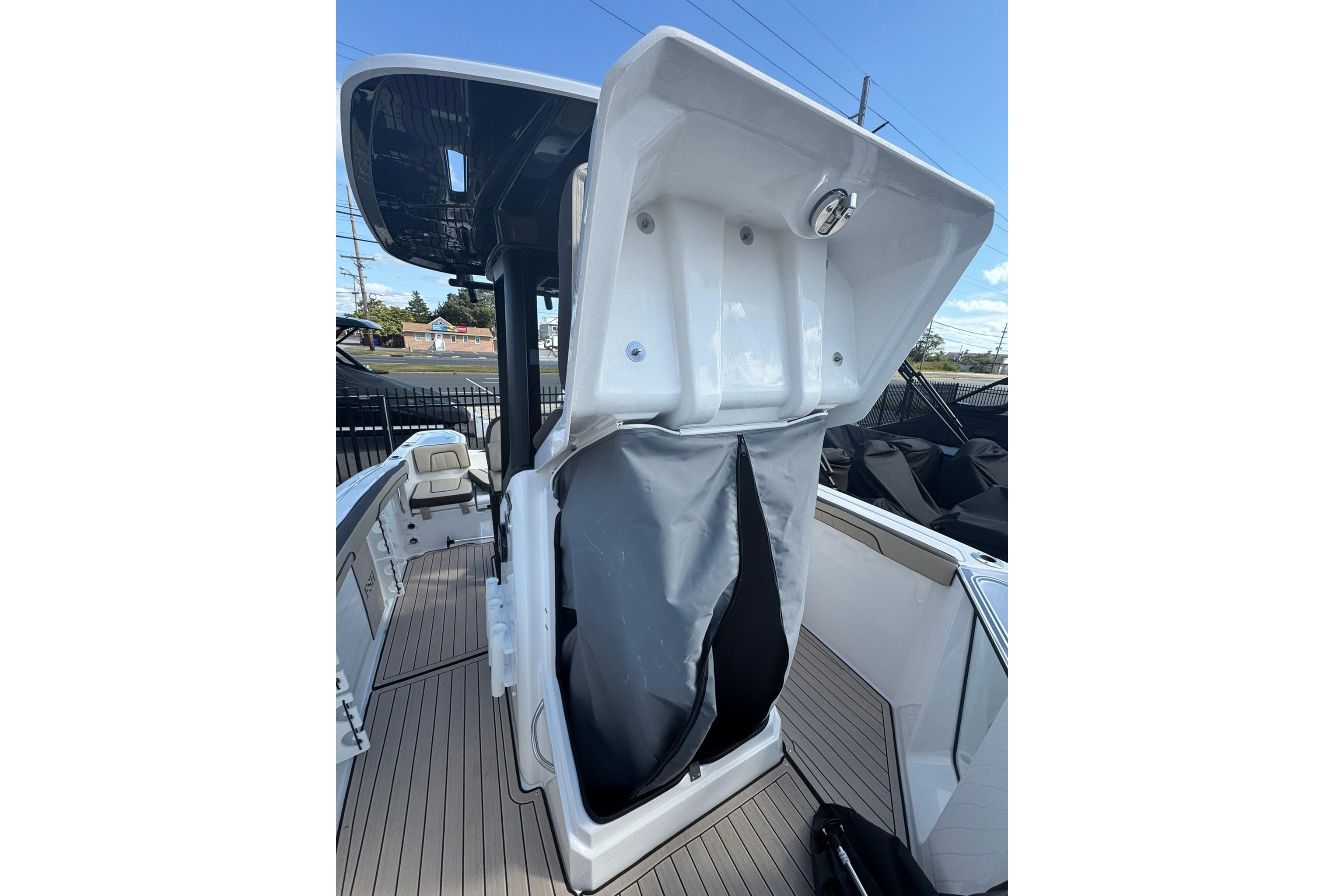 2026 Yamaha Boats 255 FSH Sport H interior with open storage compartment.
