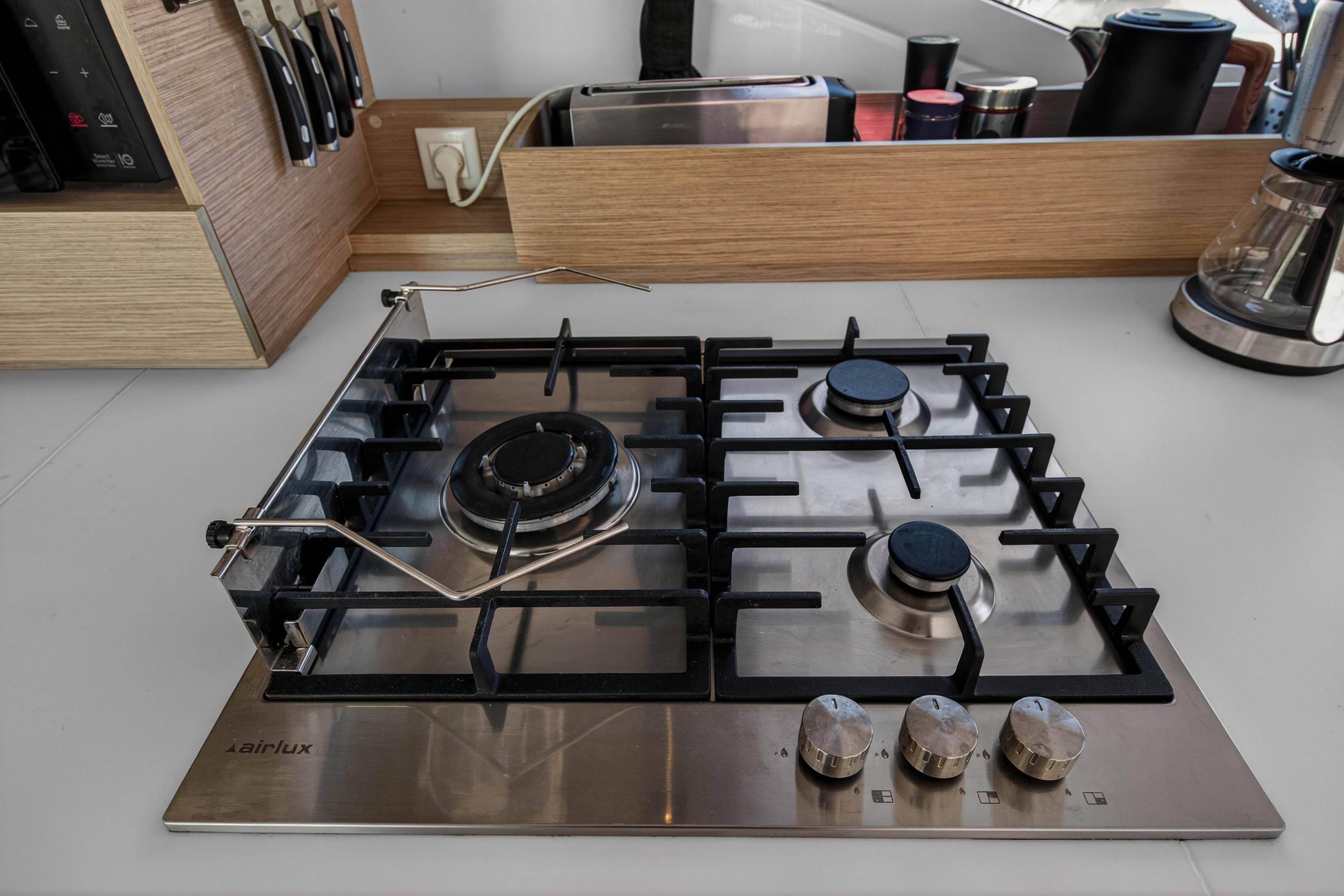 Modern kitchen stove on 2022 Fountaine Pajot Tanna 47 yacht, featuring sleek design and functionality.