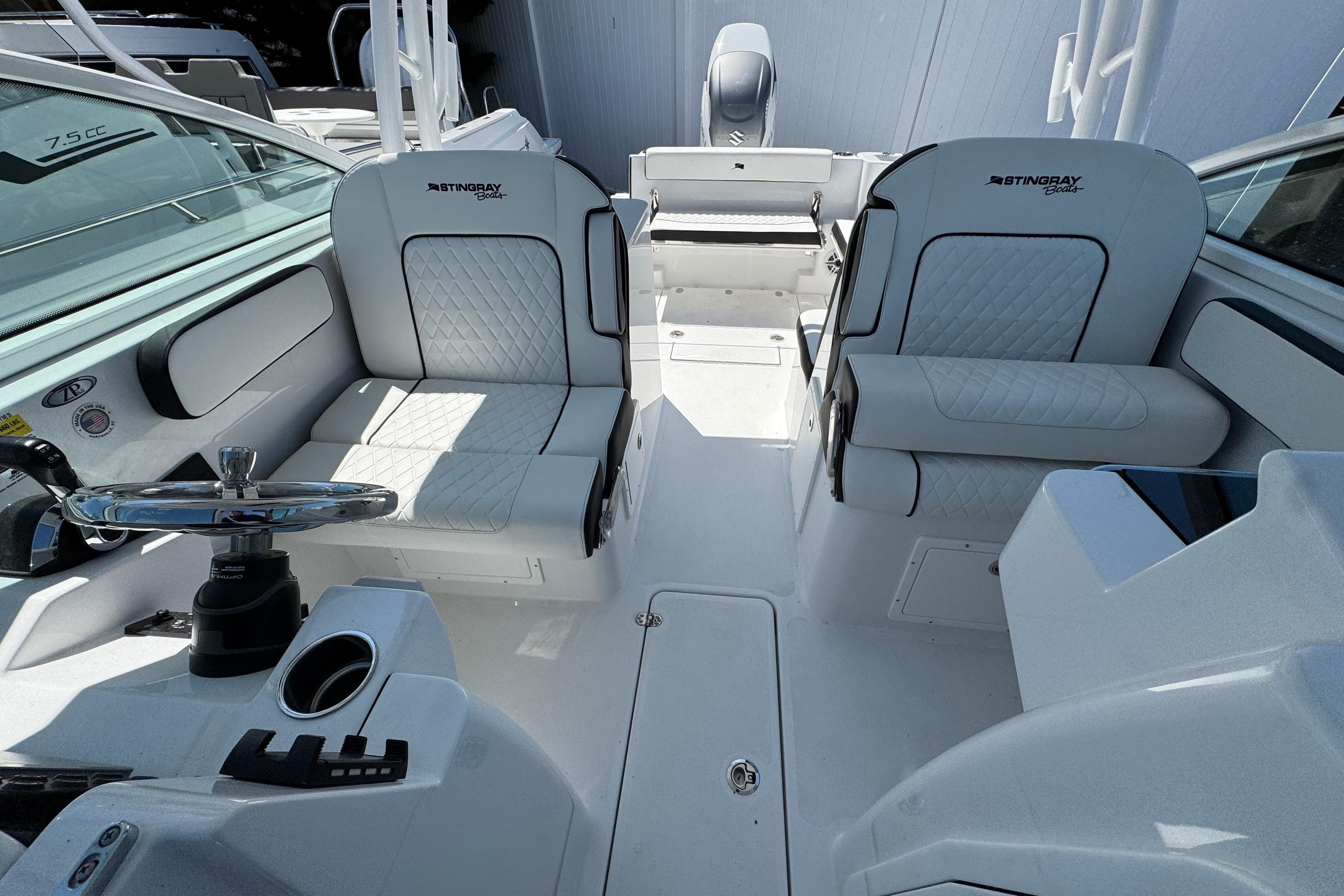 2026 Stingray 259 DC boat interior with dual seating and modern steering console.
