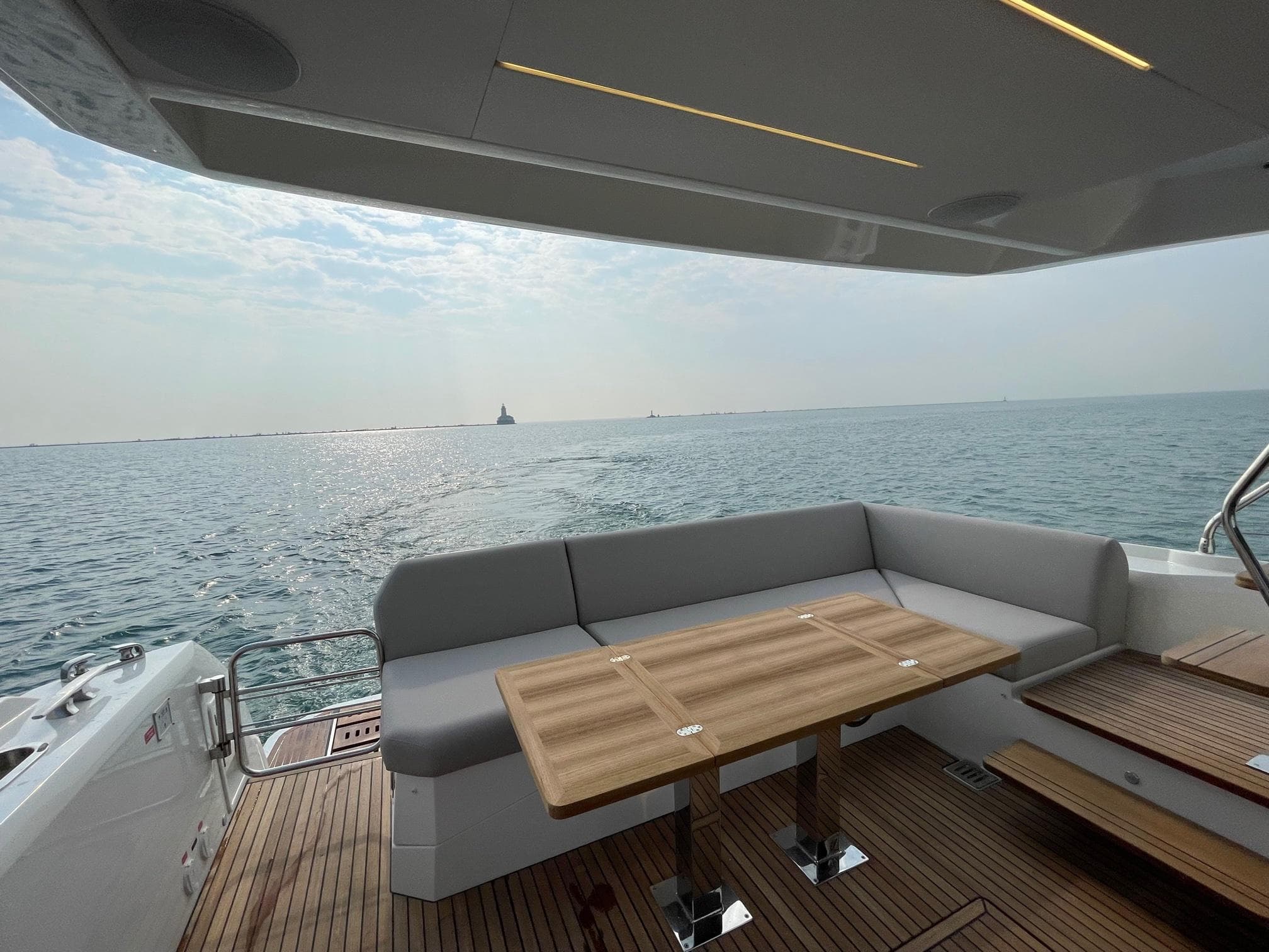 2024 Prestige 520 Flybridge yacht deck with seating and ocean view.