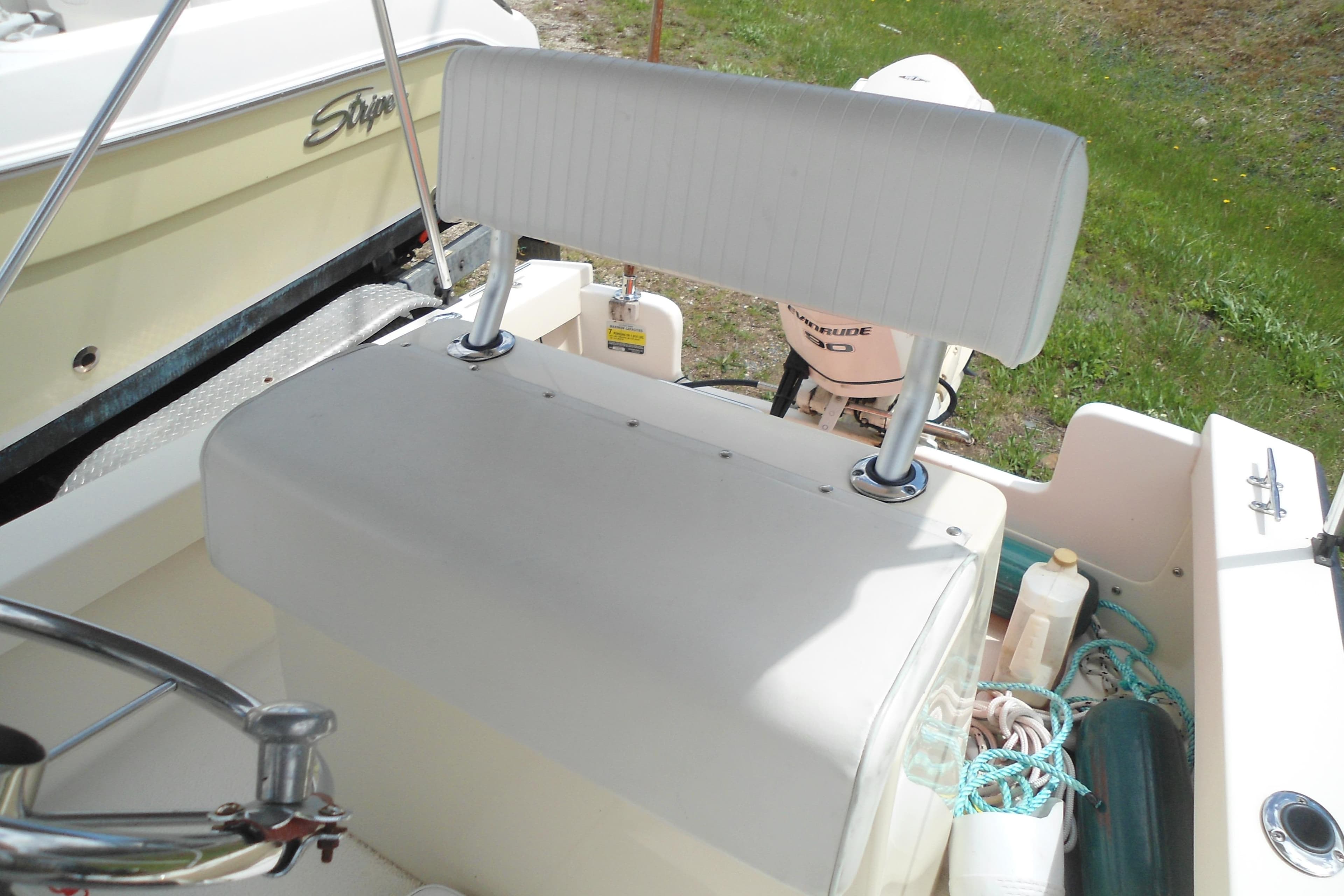 2008 Eastern Boats 18 interior with steering wheel and storage area.