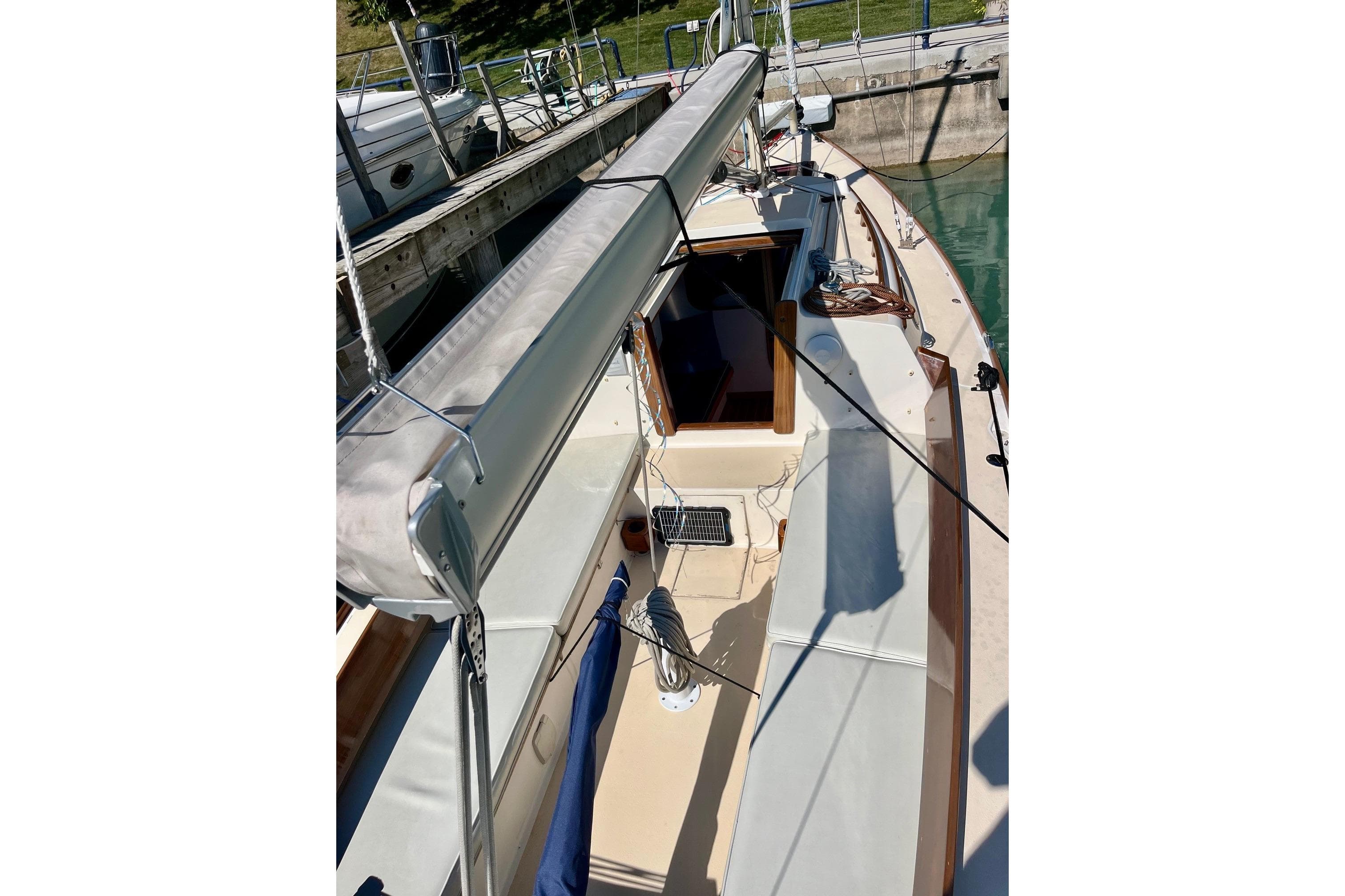 2012 Alerion Express 28 sailboat docked, showcasing deck and cockpit area.