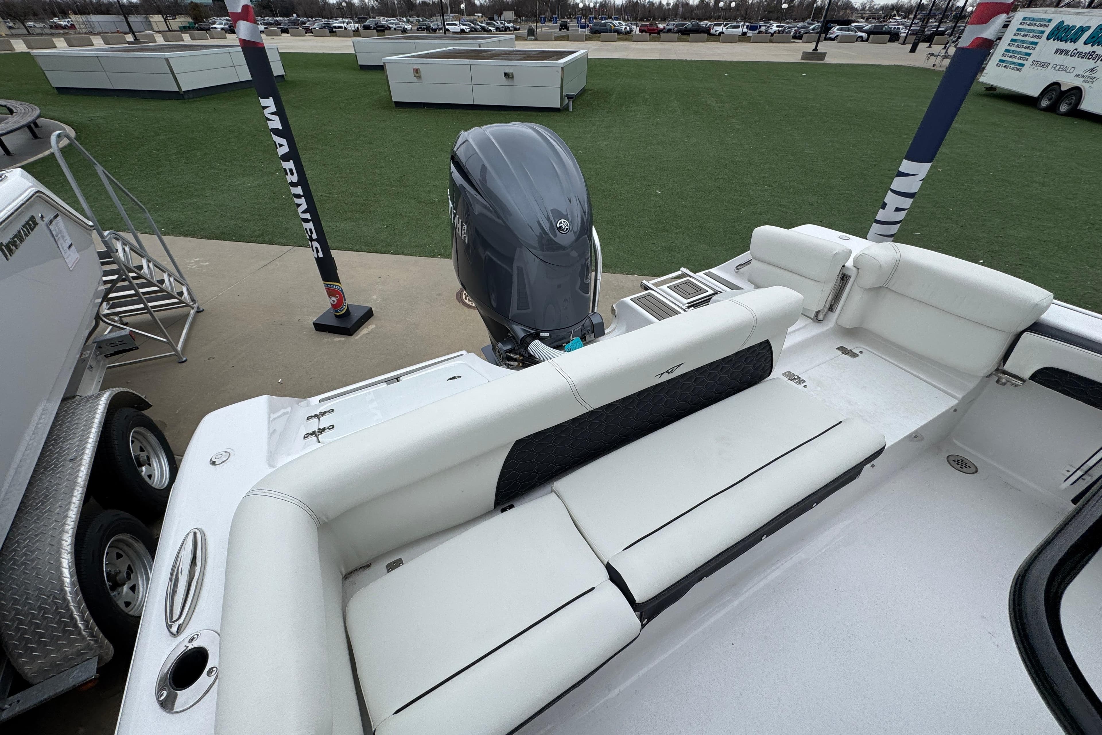 2026 Tidewater 220 LXF boat interior with seating and outboard motor.