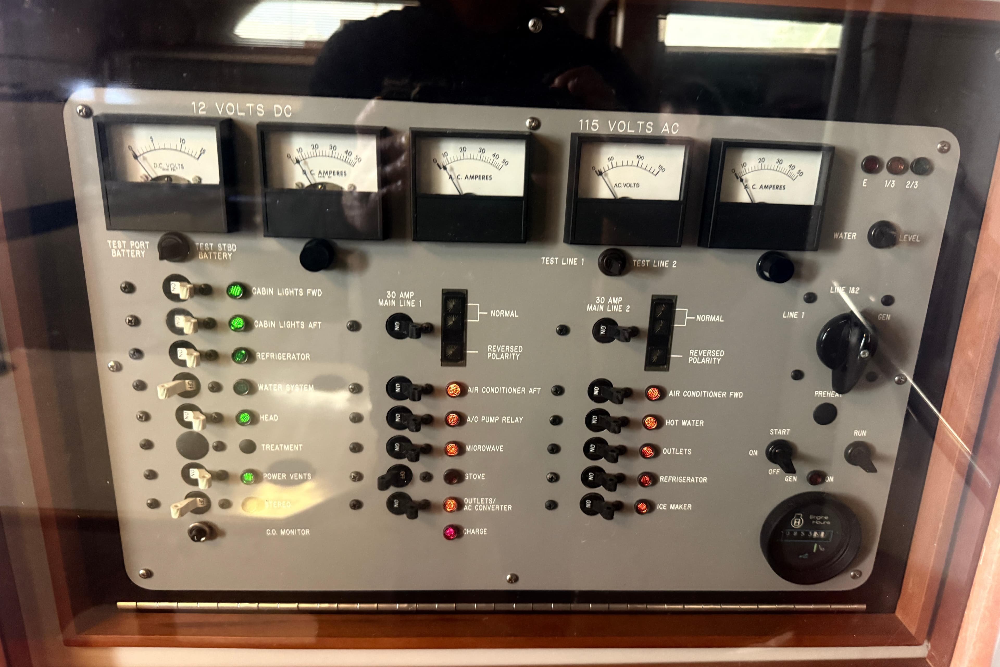 Control panel of a 1988 Sea Ray 390 Express Cruiser with gauges and switches.