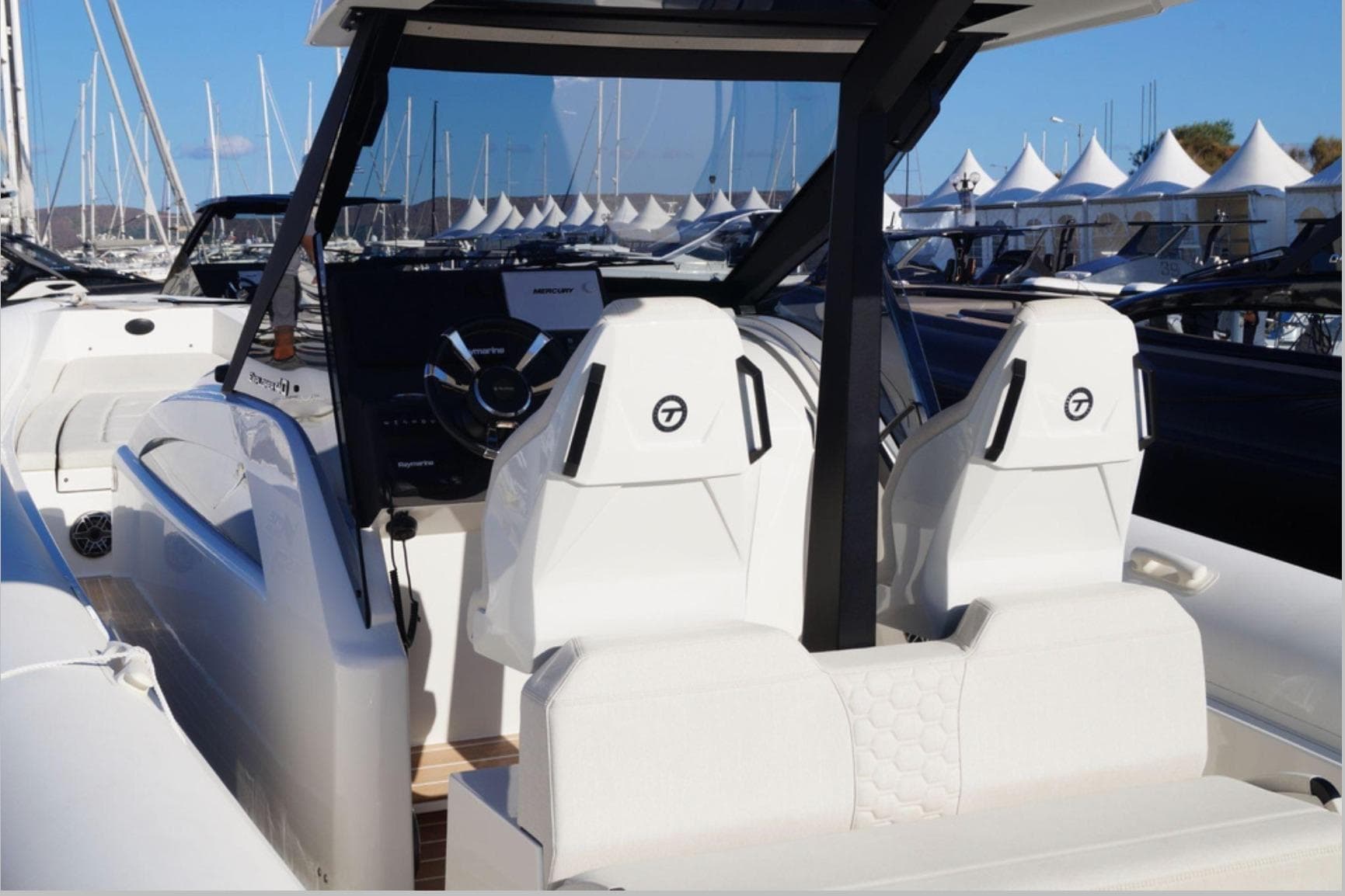 2022 Technohull 12b boat interior with modern seating and steering console.