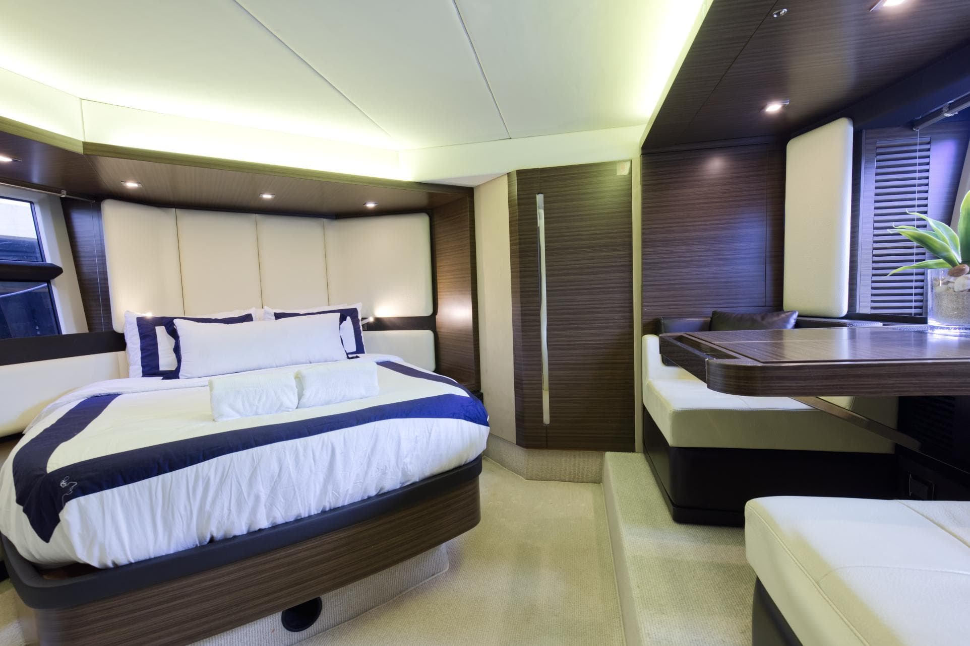 Luxurious bedroom interior of 2013 Azimut 55S yacht with modern design.