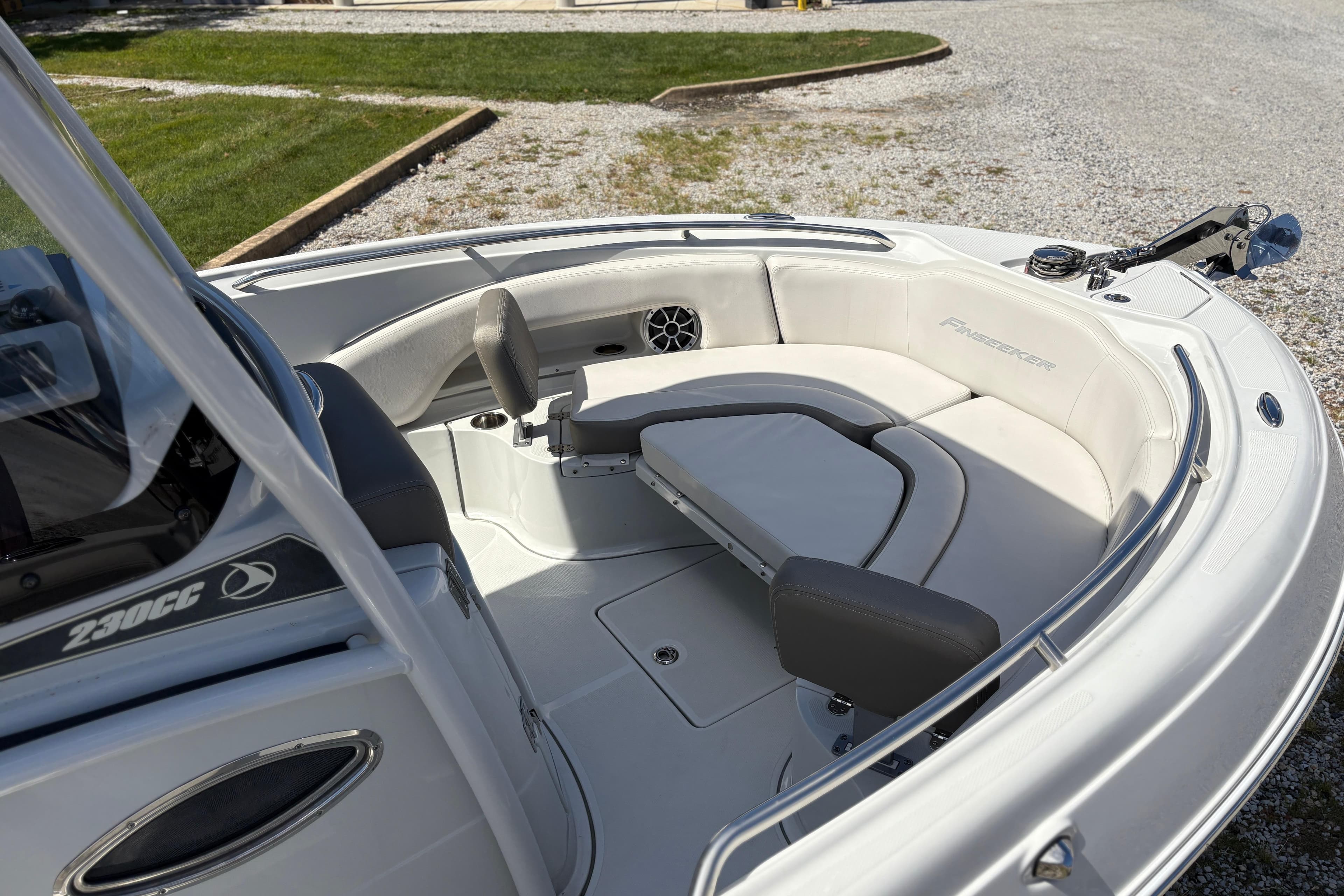 2023 Finseeker 230cc boat interior with cushioned seating and sleek design.