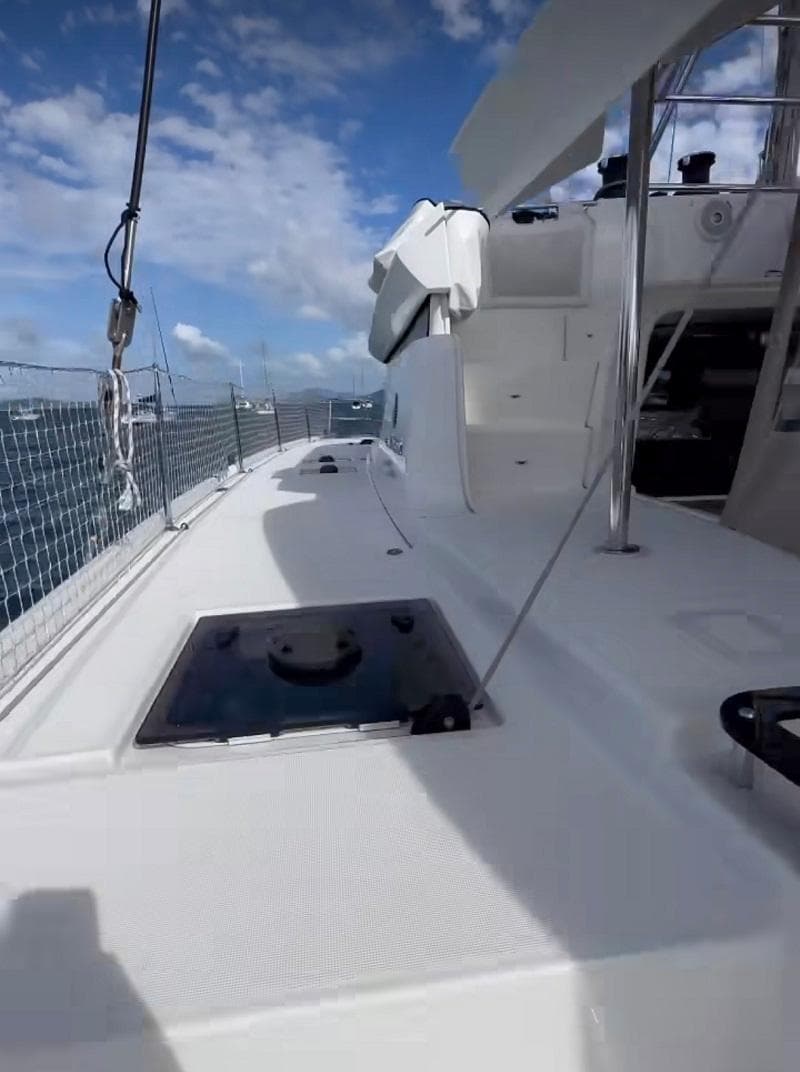 2022 Lagoon 46 yacht deck with clear skies and ocean view.