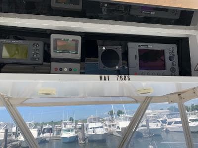 Control panel of a 1989 Trojan 12 Meter Convertible boat at a marina.