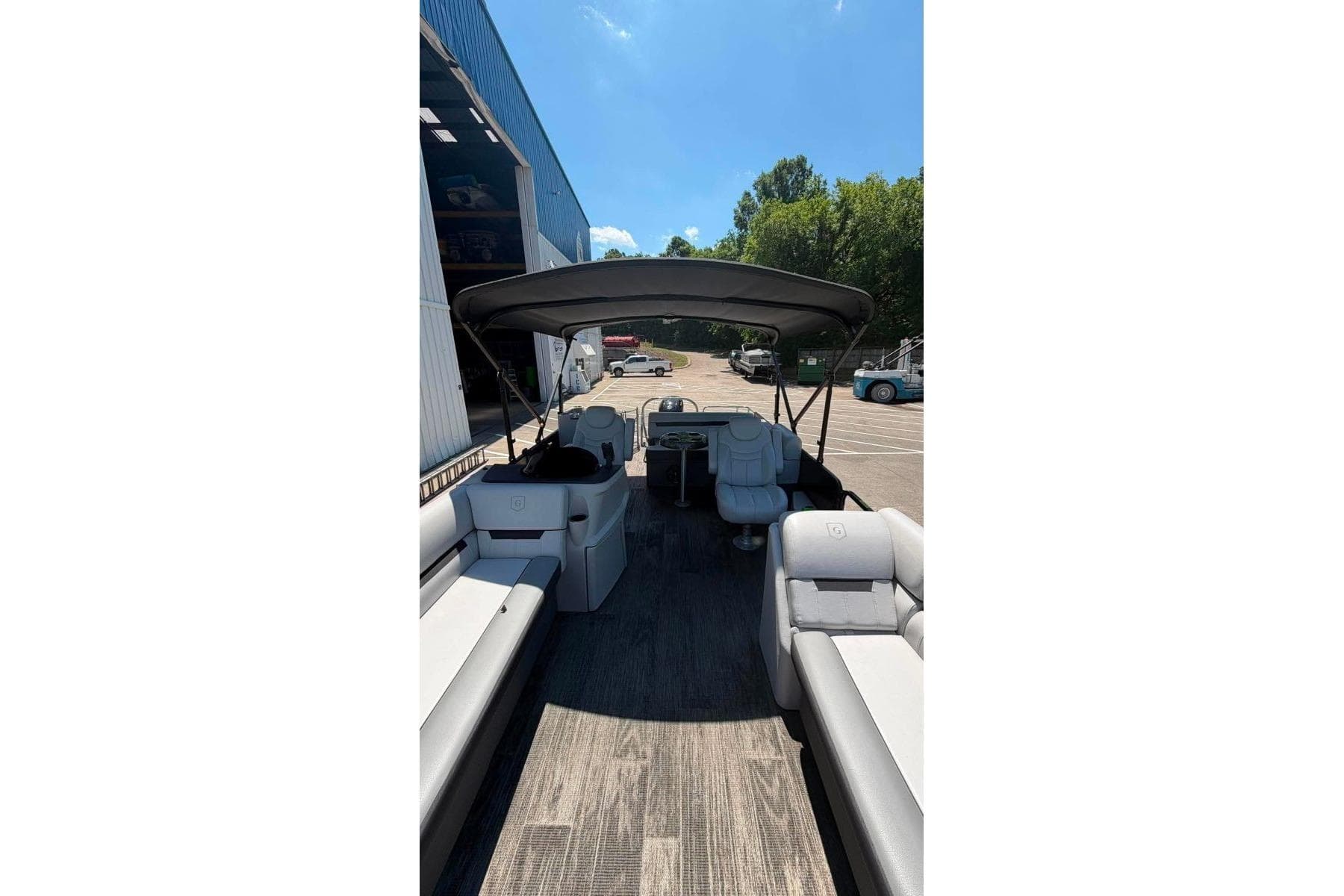 2023 Godfrey Sweetwater 2486 SFL pontoon boat interior with seating and canopy.
