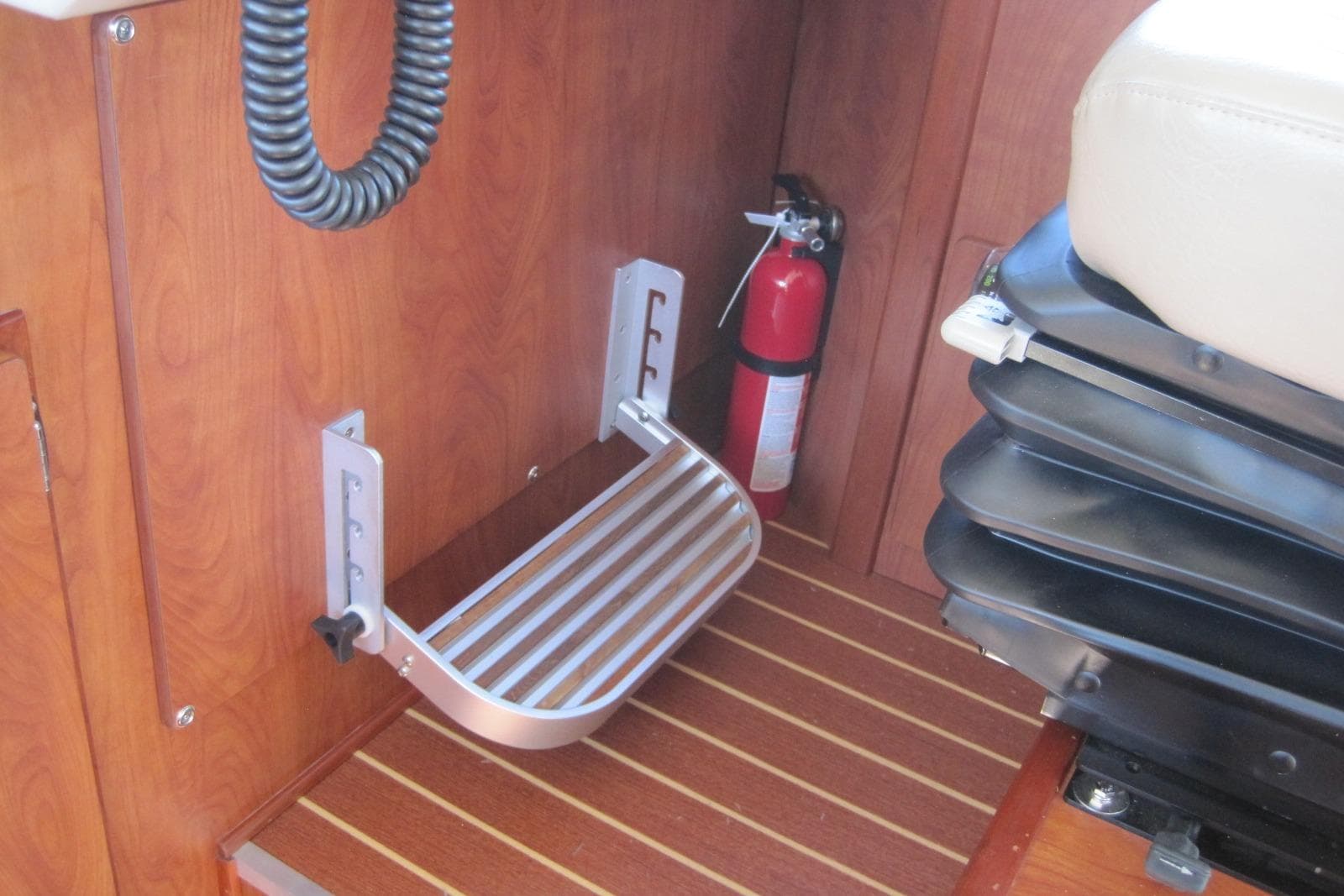 Interior of 2020 EagleCraft 36' Cruiser with footrest and fire extinguisher.