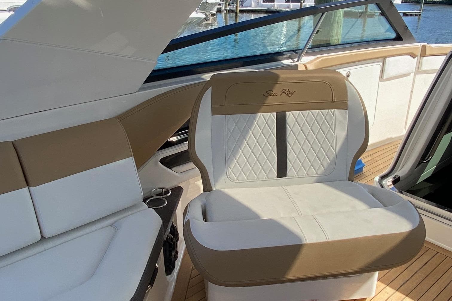 2019 Sea Ray SLX 400 boat interior with beige and white seating.